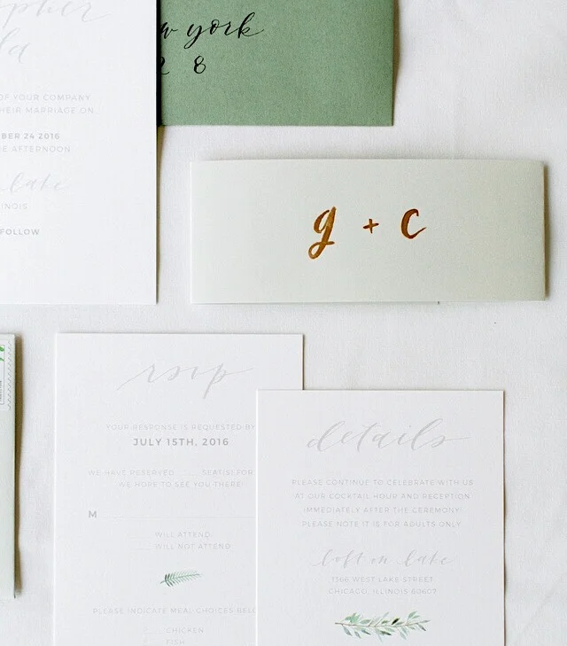 I used a belly band for my own invitations, and hand painted them with our initials. Design by Grace Niu Design, photo by Mayden Photography.