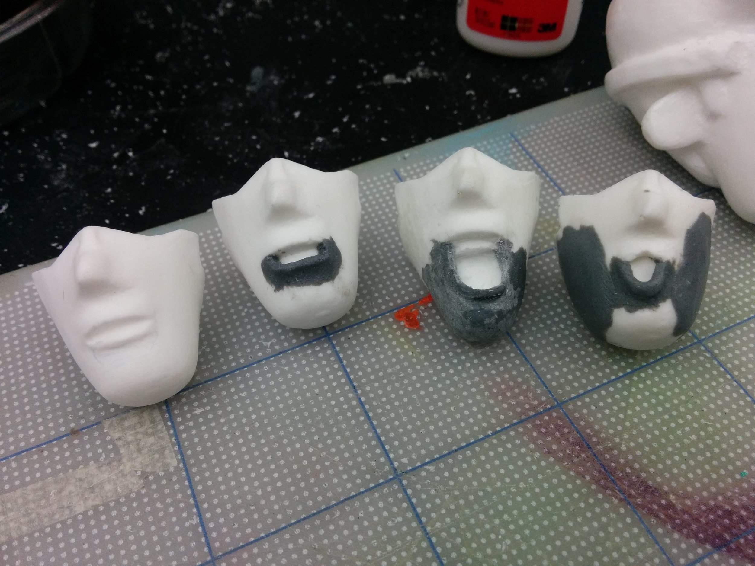 Replacement faces re-sculpted with epoxy putty.