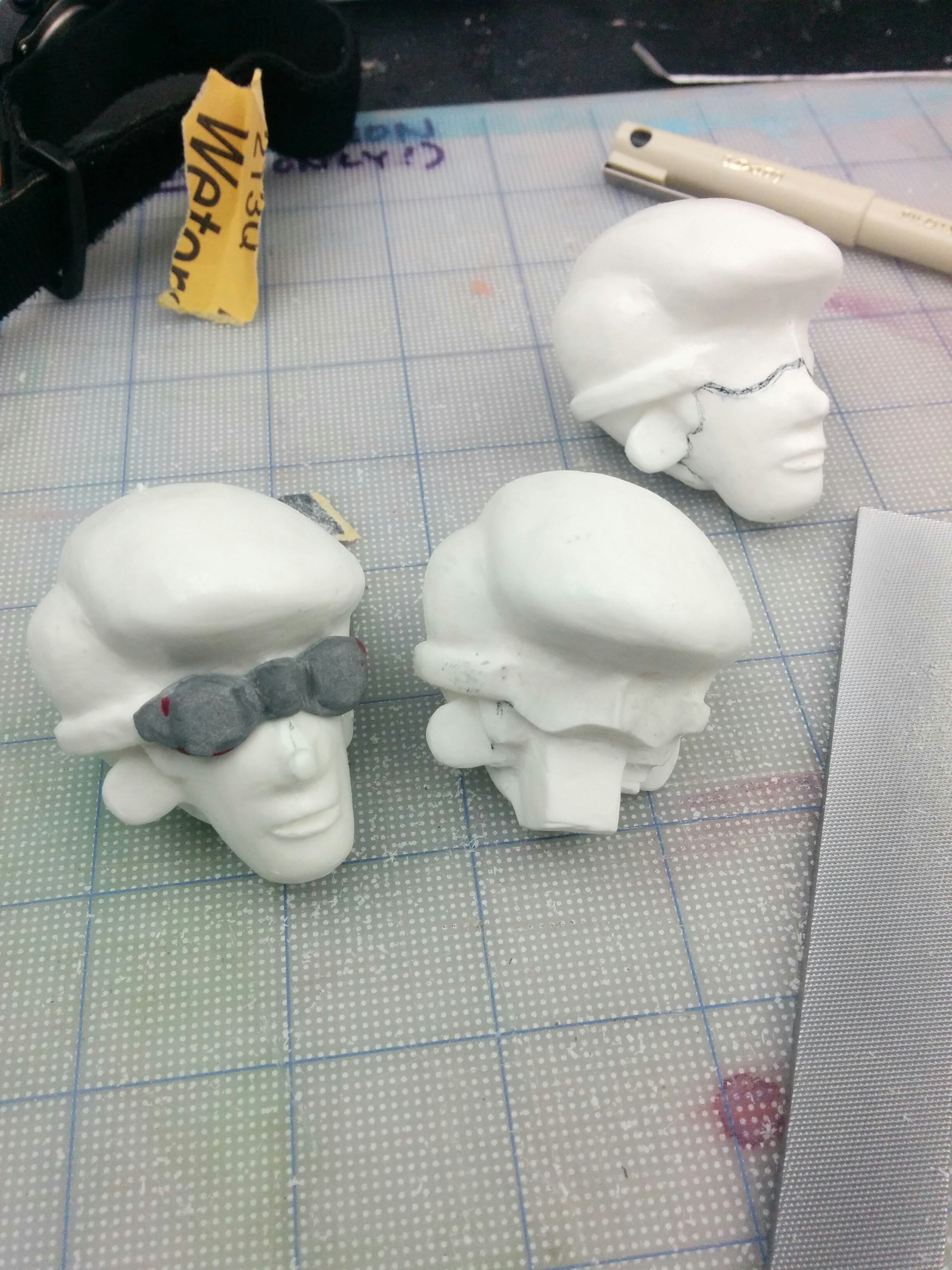  The face replacements were made using two head cast carved down with a Dremel to make the mouth swaps. 