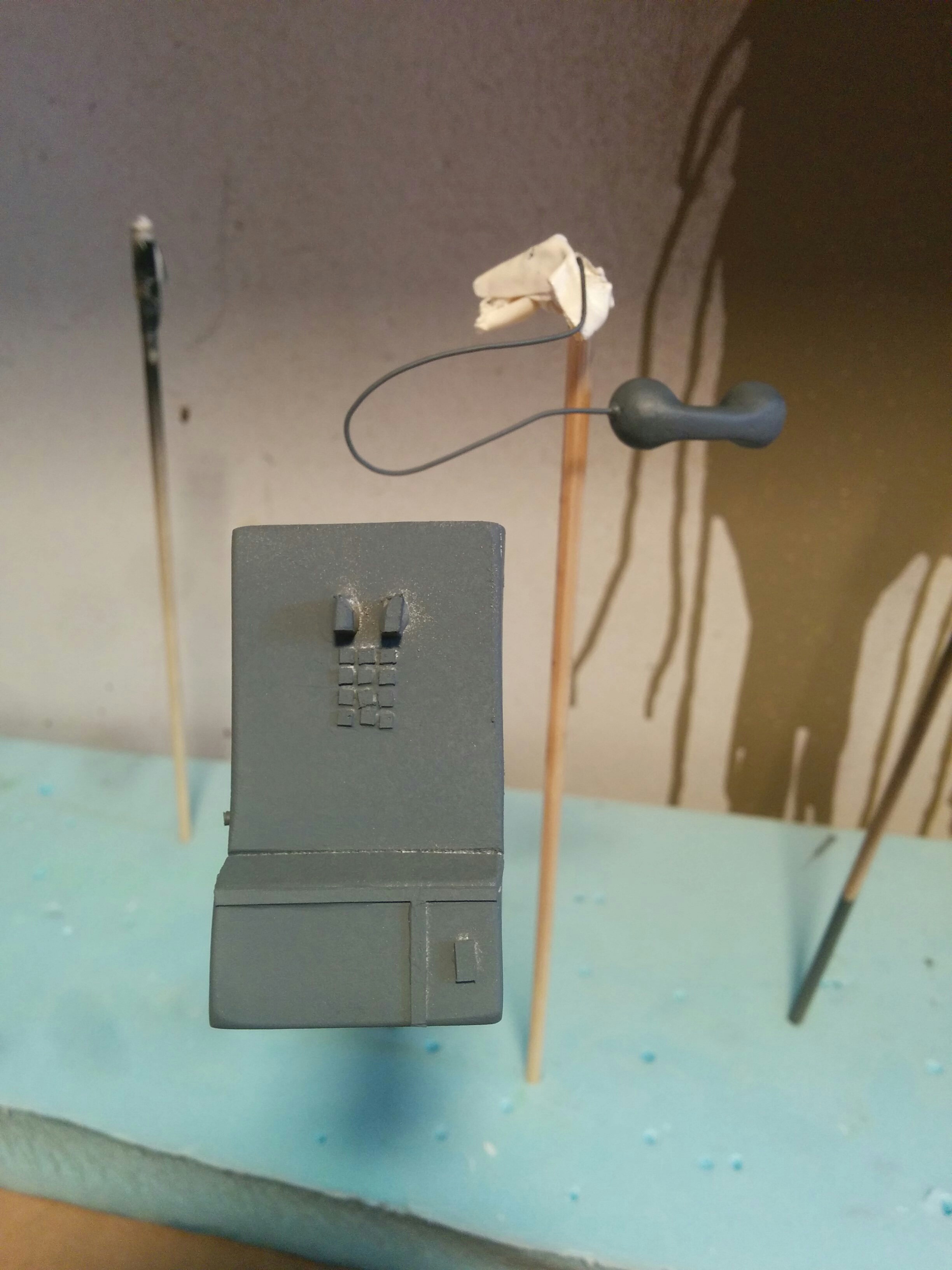 Public telephone booth prop, created using polystyrene. Phone receiver modeled with epoxy putty