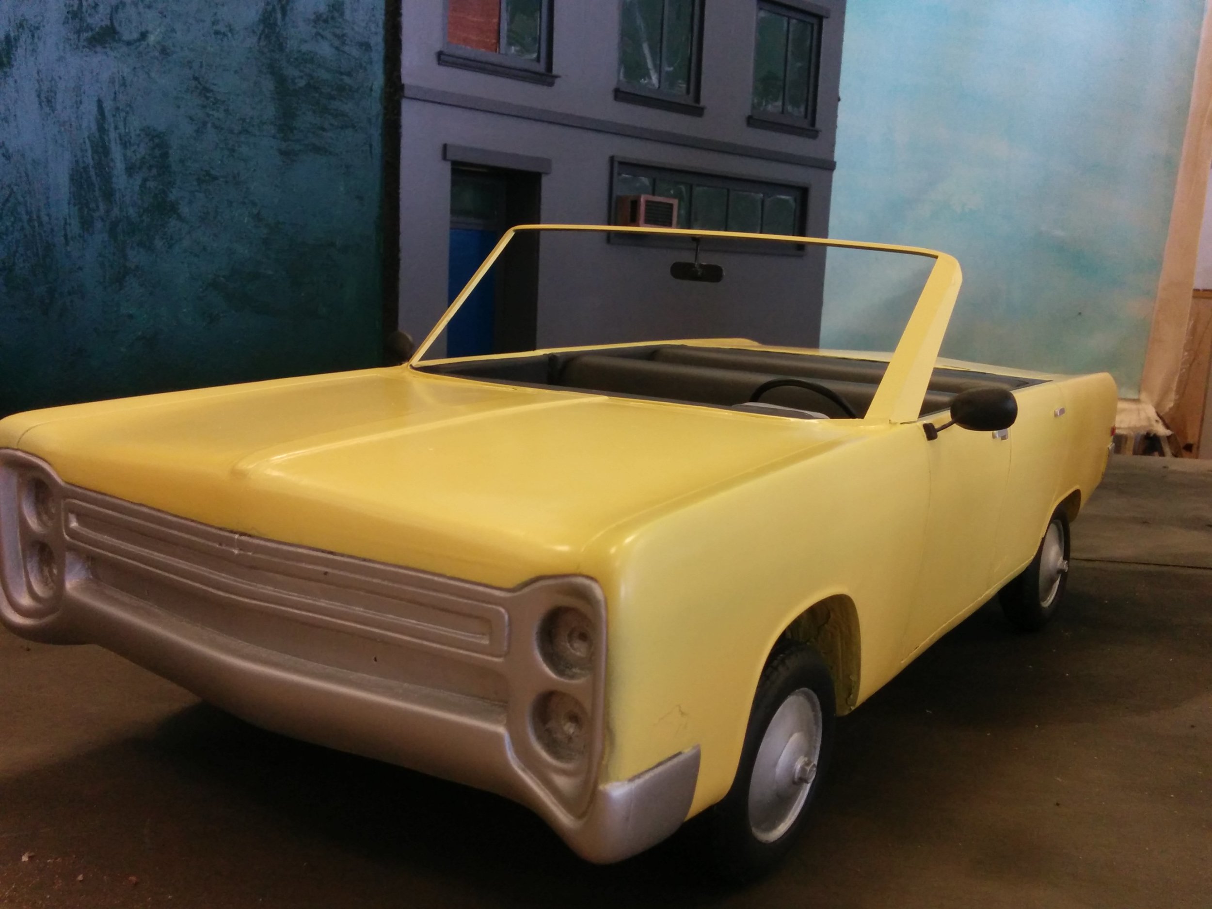 Basla foam model car. I am responsible for building the windshield, repairing the model, rigging the wheels with brass tubing and painting the prop.
