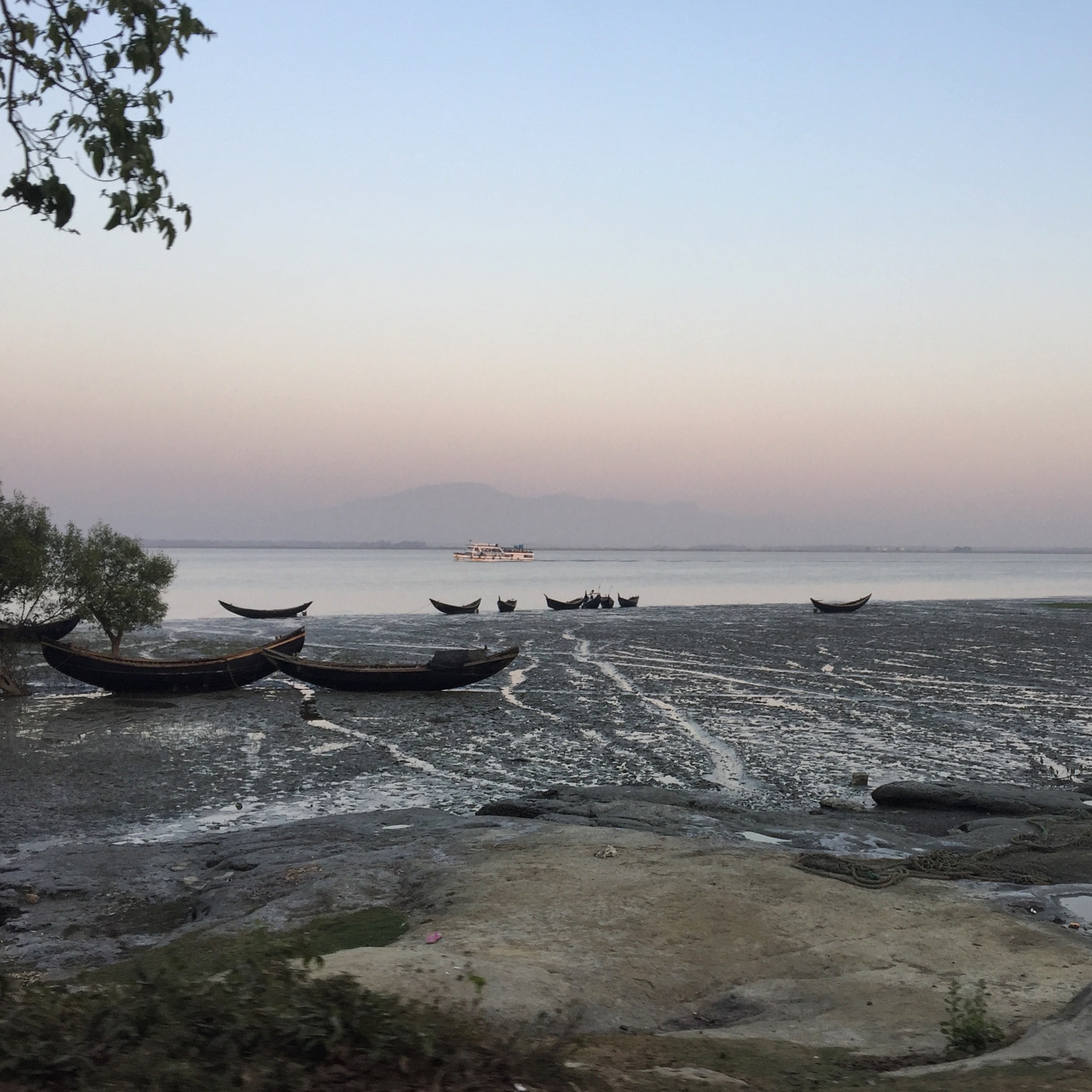  TEKNAF | The faint outlines of Myanmar seen from the Naf River in Teknaf, which marks the official border. Thousands of Rohingya have paid boat smugglers to take them the short distance across. Bangladesh border police typically intercept 4000-5000 