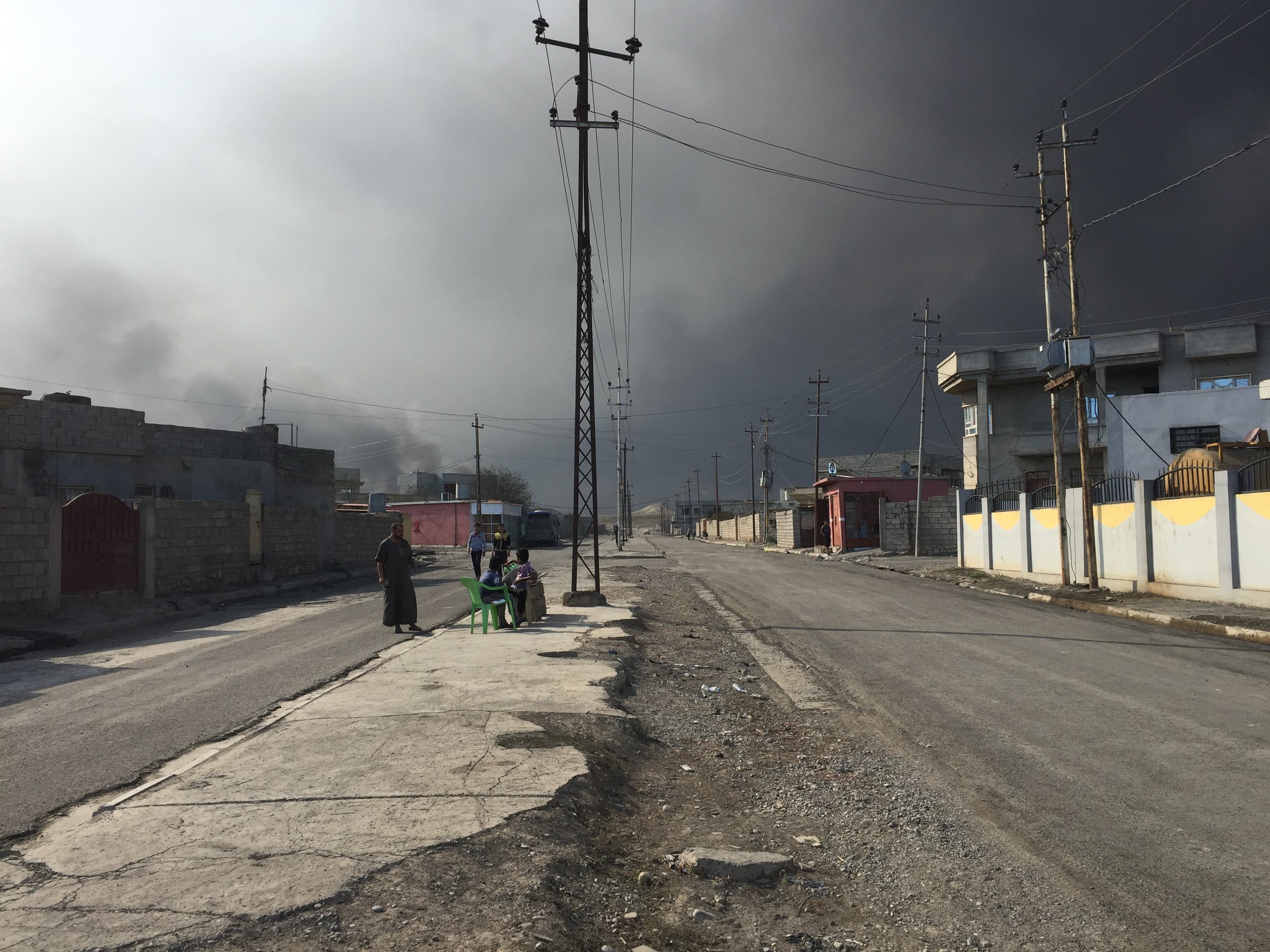  QAYARA | Residents living in Qayara under a cloud of black smoke.&nbsp;ISIS set 19 oil wells on fire in August. November 3, 2016.&nbsp; 