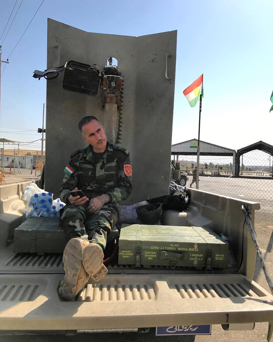  NORTH OF ALTON KUPRI | Peshmurga fighter waits near the defensive line just north of the Kirkuk-Erbil checkpoint. A few kilometers south is Alton Kupri/Pirde, the last town in the disputed Kirkuk province held by Kurdish forces and seized by the Ira