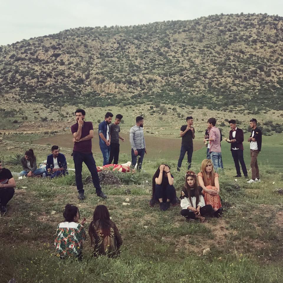  LALISH | Yazidis while away the afternoon on the hills near the Lalish temple, where many came to mark Charshama Sor ("Red Wednesday"), the celebration of Yazidi New Year which occurs in April. April 18, 2018.  