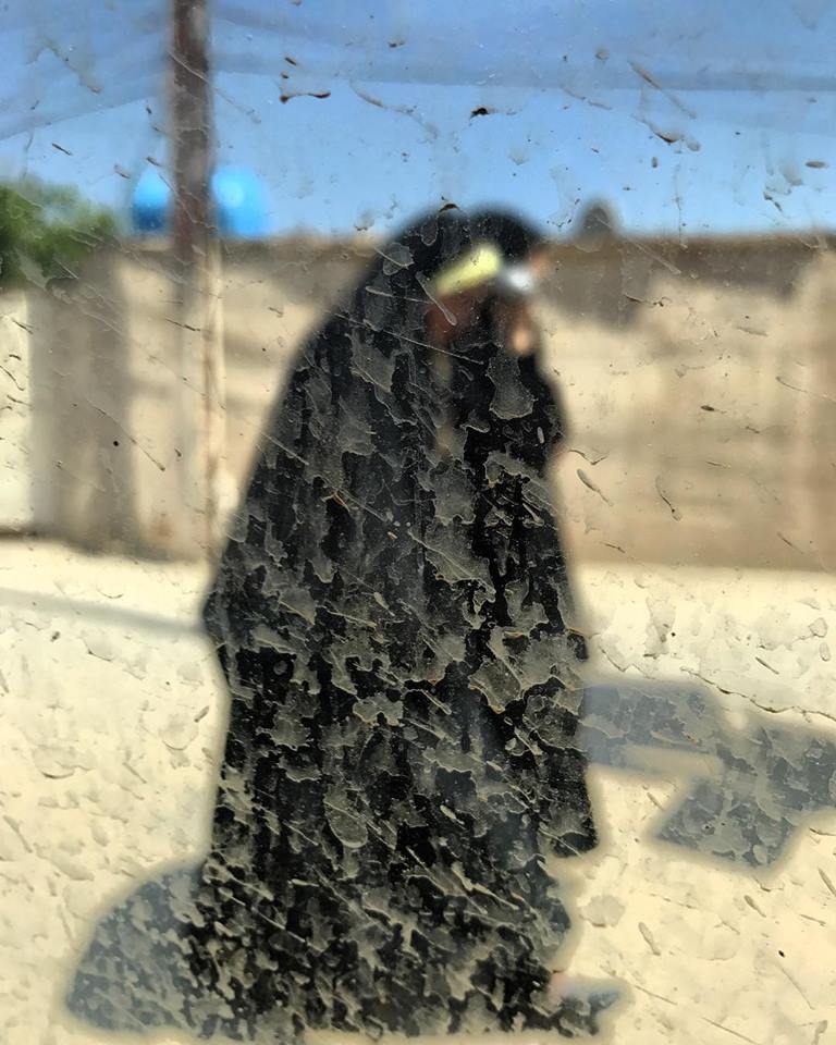 BAGHDAD | Women walk down the street on a dusty day in the capital. April 23, 2018.