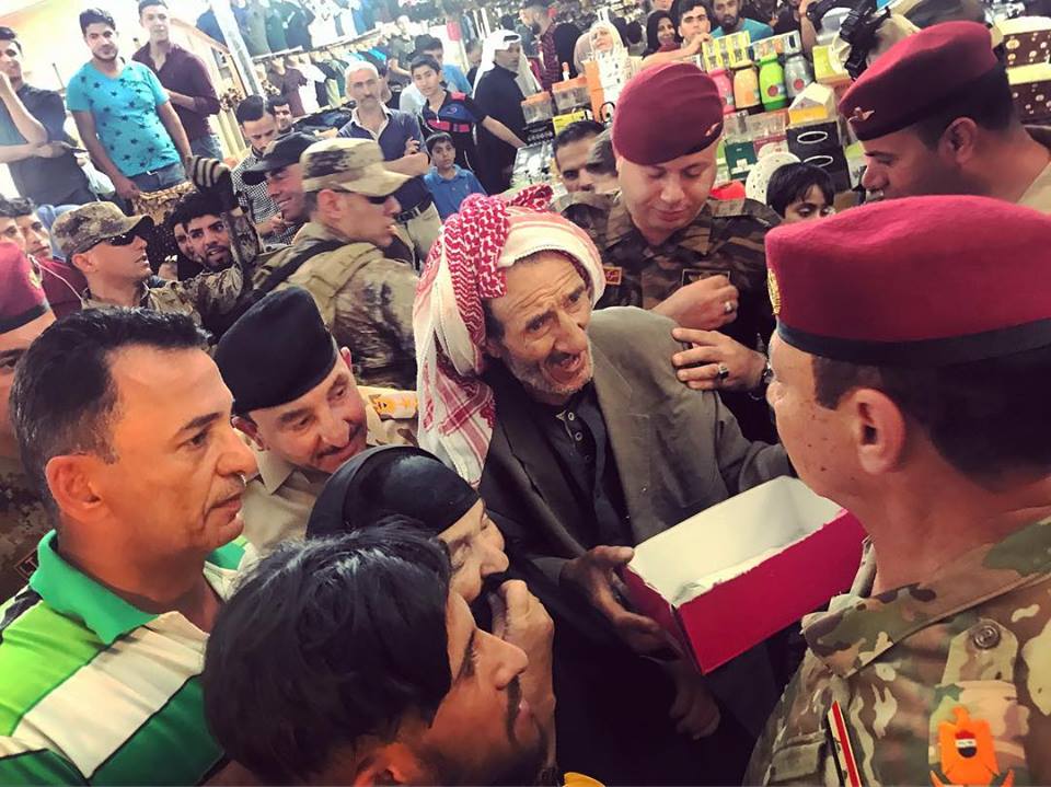  MOSUL | Maj. Gen. Najm al-Jibouri, commander in chief of the Ninevah Operations Command, takes a walk down the souk in the Nabih Younes neighborhood of Mosul. Dozens of residents stop him complaining of destroyed homes, lost relatives, poverty. Most