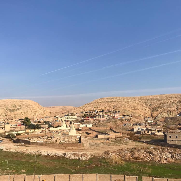  BASHIQA | Restored Yazidi temples - destroyed when IS overran the town 2014-2016 - lie below Bashiqa mountain. Reminders of IS occupation remain: Residents point to the caves where snipers routinely fired shots at passers by, the rubble of homes bel