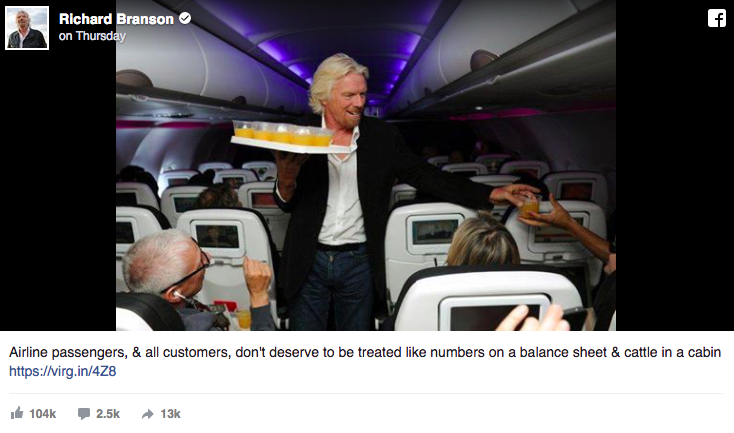Richard Branson's Facebook post of him serving drinks to his passengers. 
