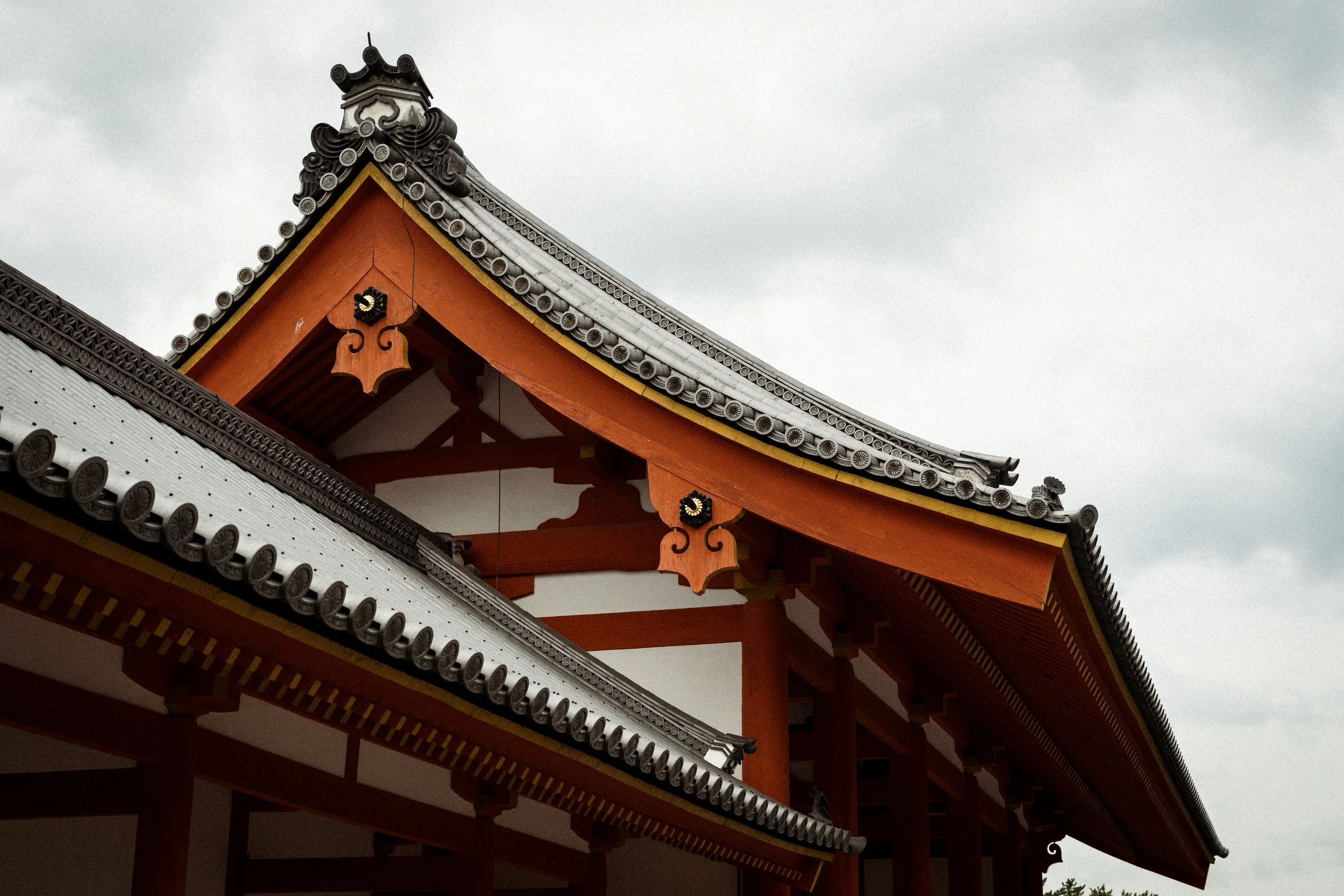 Traditional Japanese temple pagoda rooftop in red