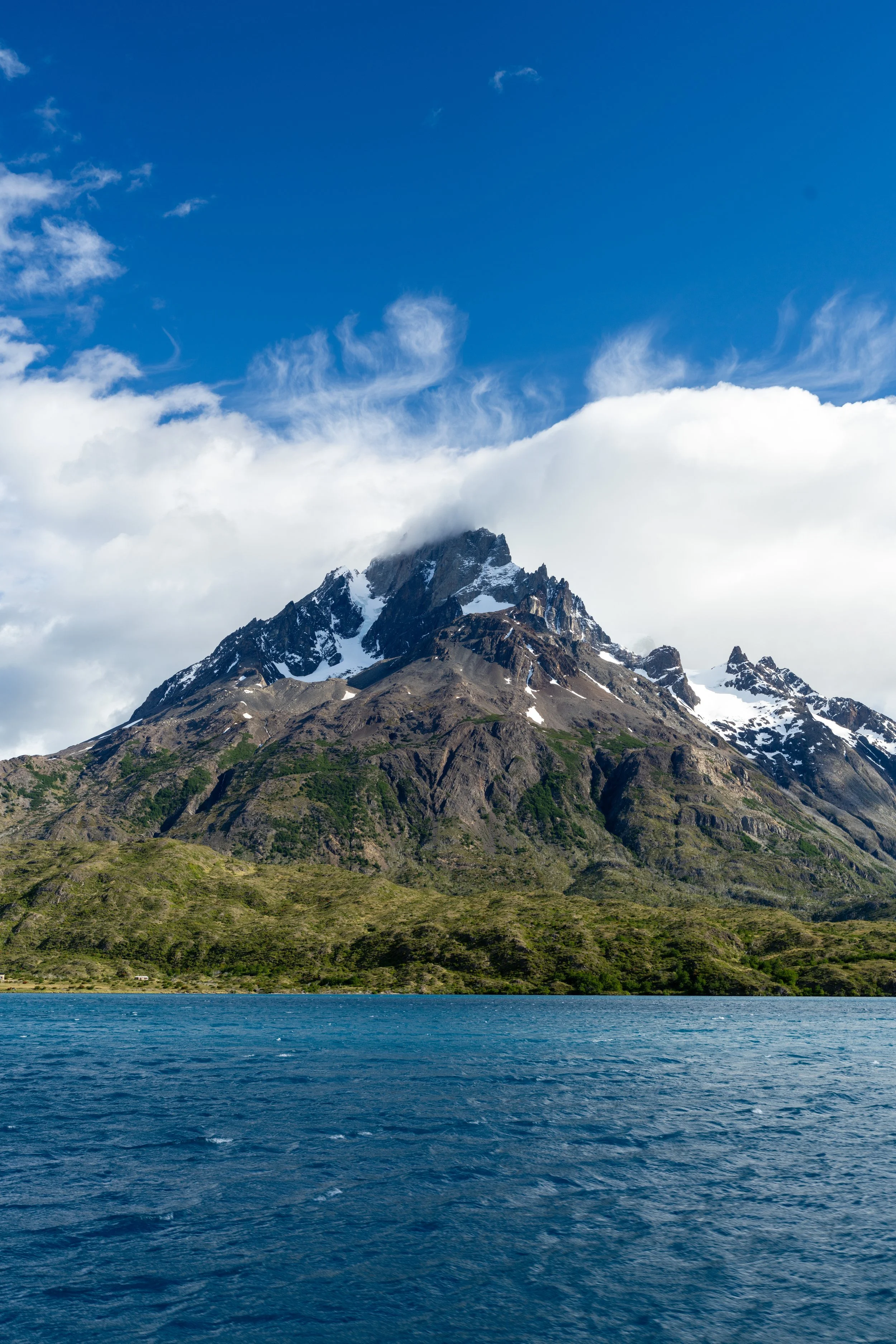 Patagonian glacier and mountain peaks reflected in turquoise water