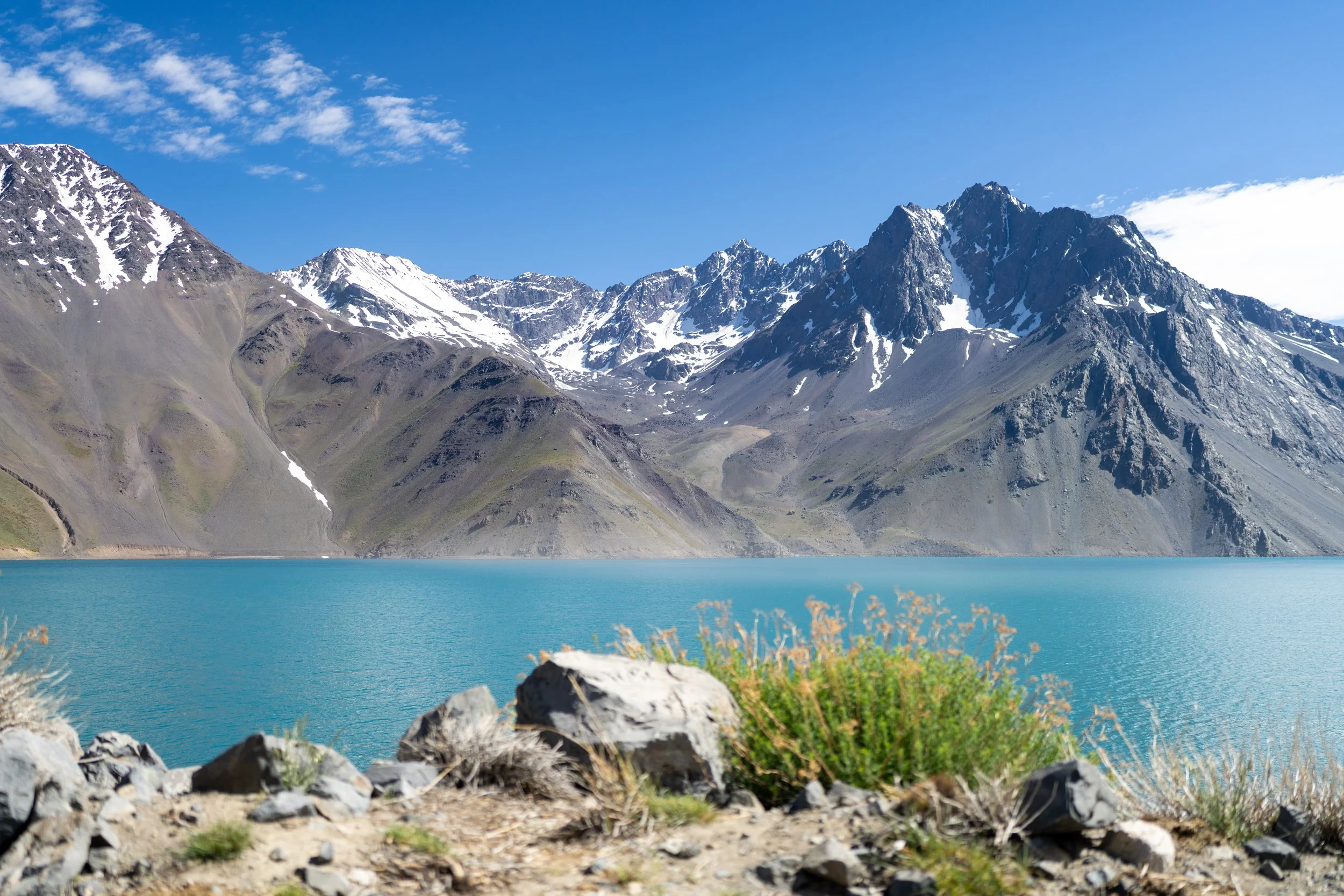 Snow-capped Andean mountain with alpine lake