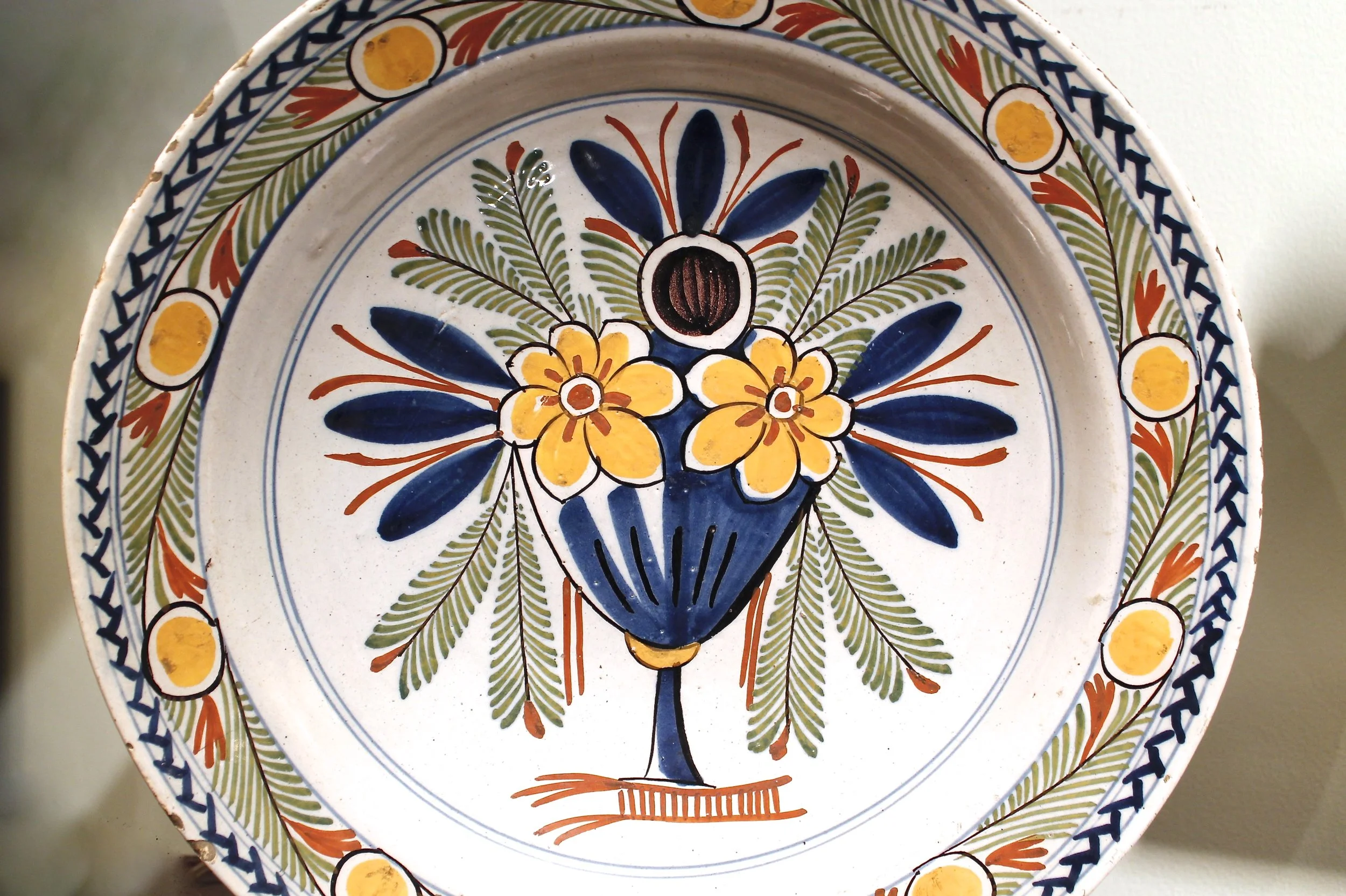 Large Polychrome Delft Charger with Flower Vase, 18th Century, 13 ½ Inche