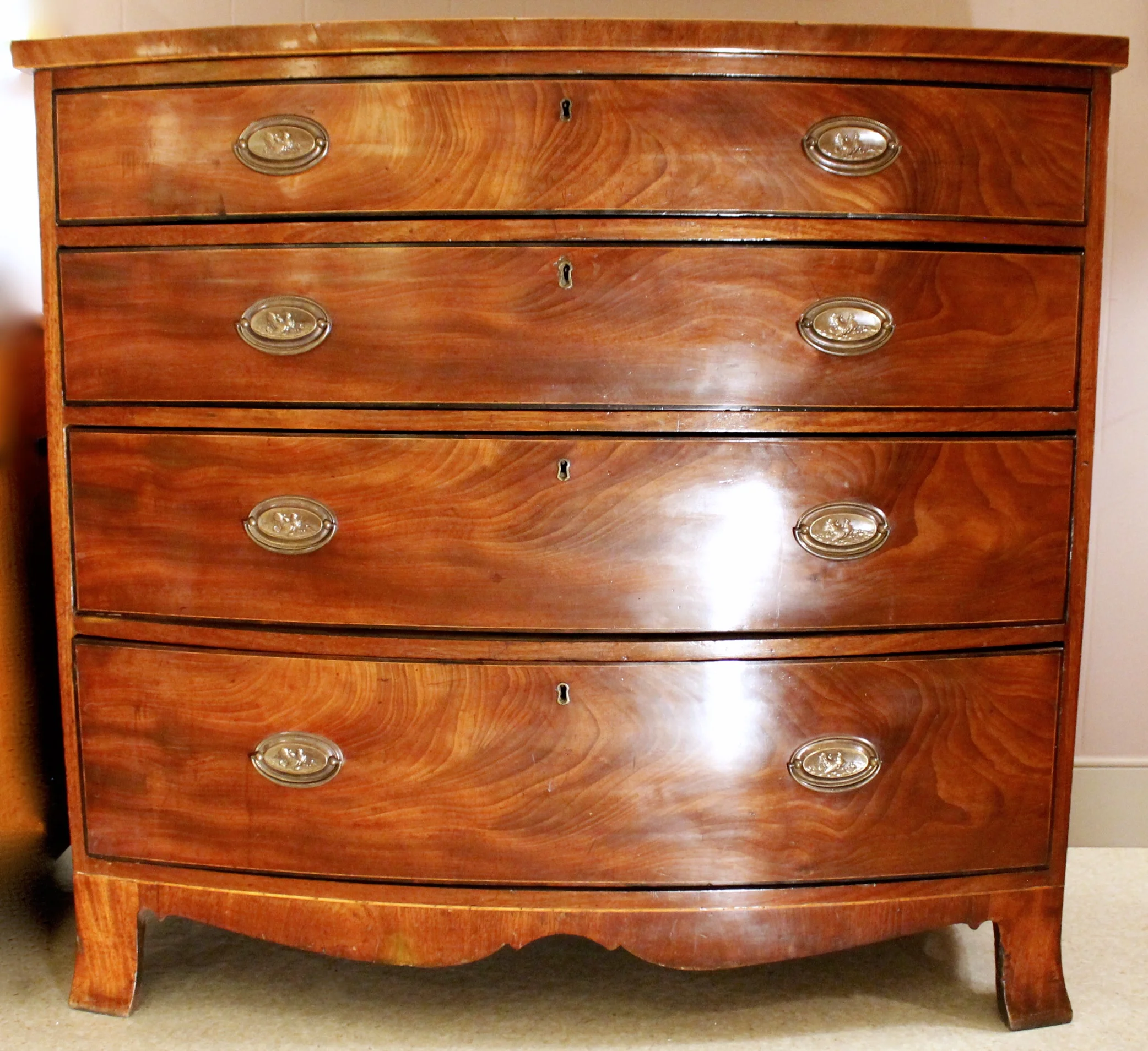 George III Figured Mahogany Bowfront Chest of Drawers with Ebonized Borders
