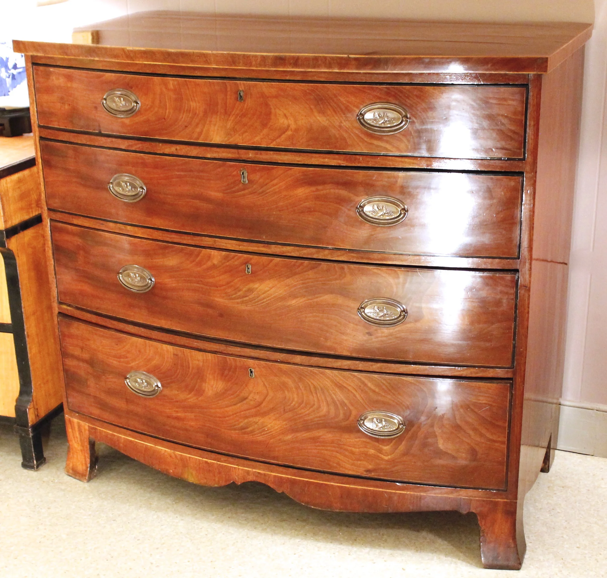 George III Figured Mahogany Bowfront Chest of Drawers with Ebonized Borders