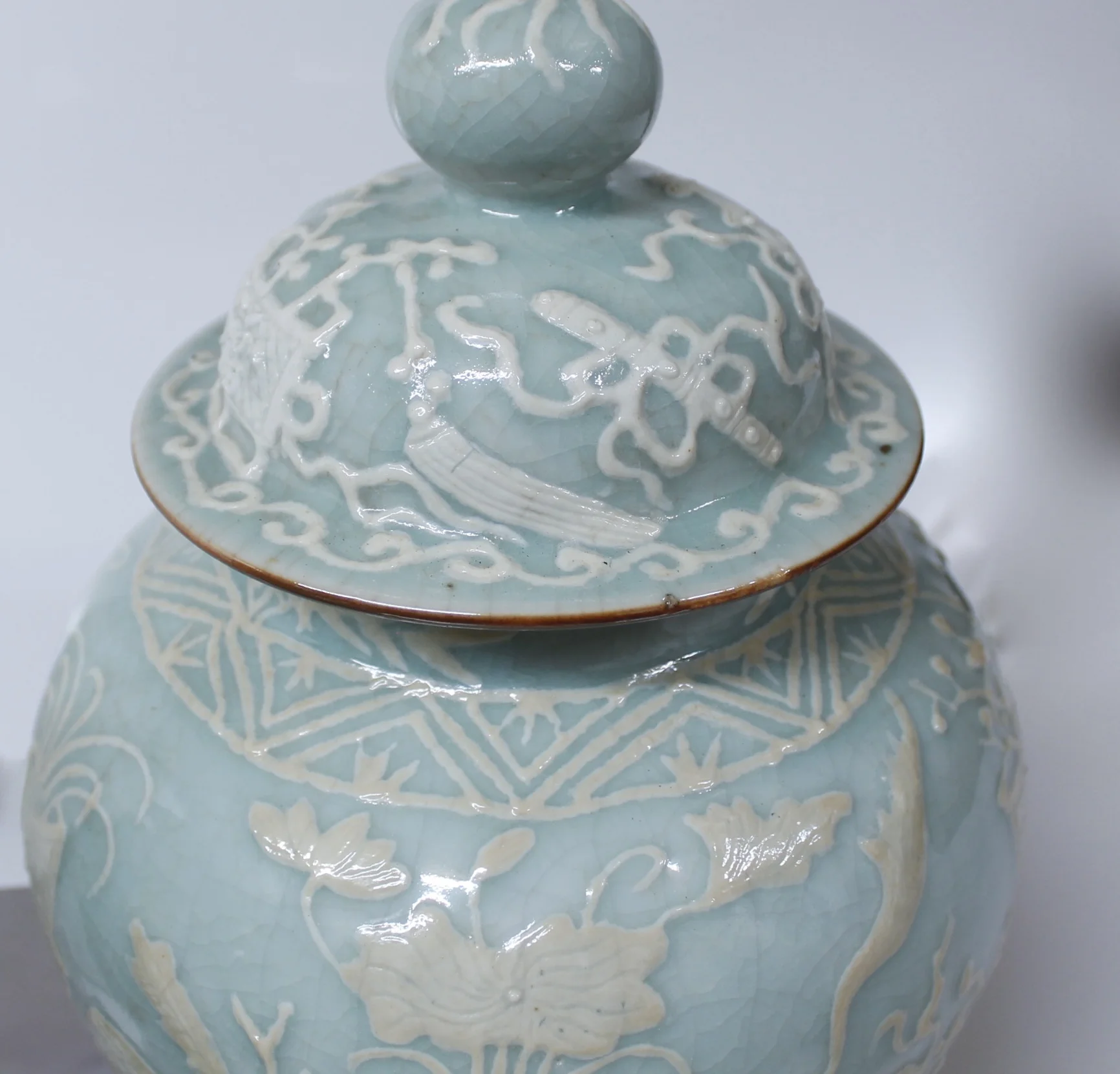 Pair of Chinese Celadon Porcelain Pâte sur Pâte Ginger Jars on Stands
