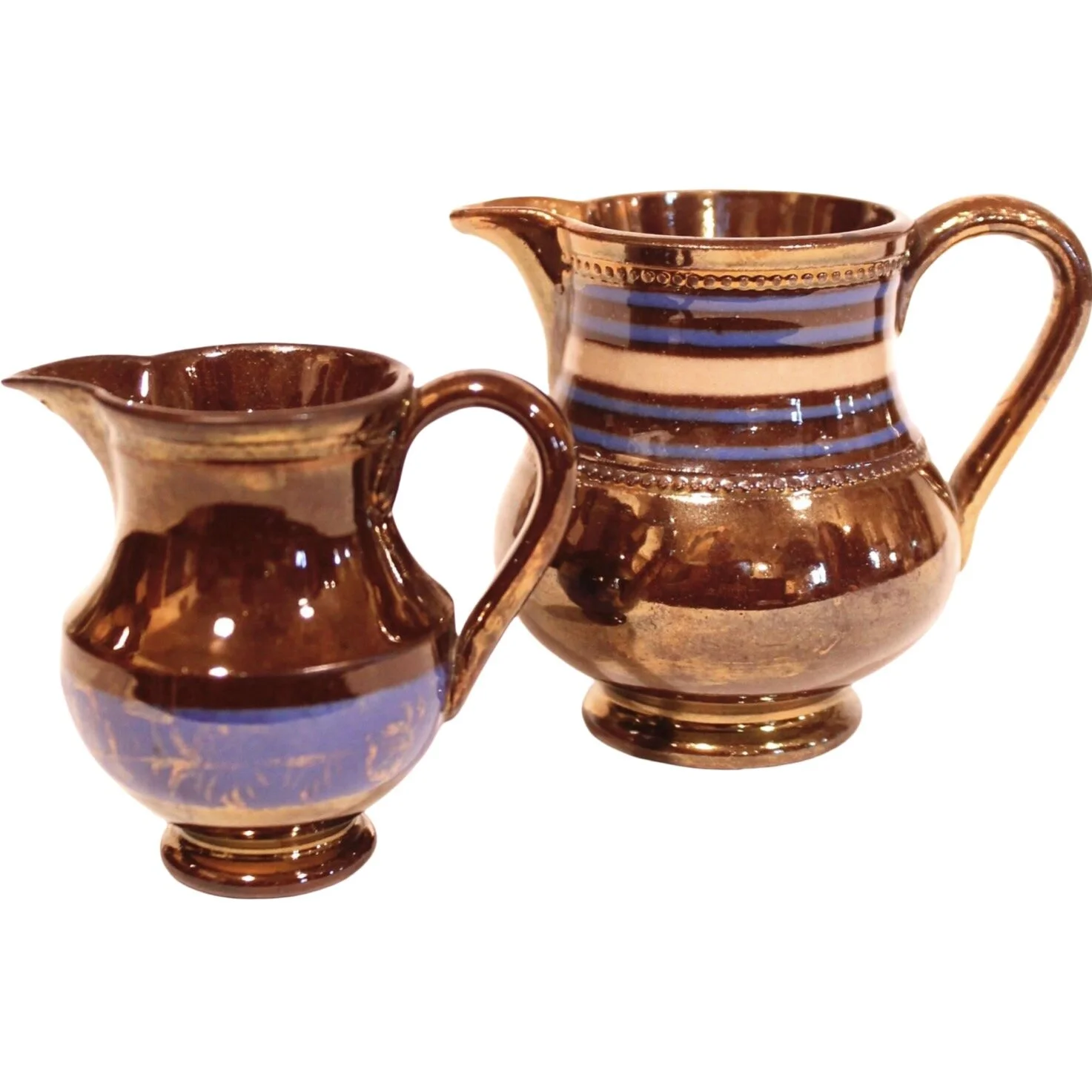 Pair of Small Dark Copper Lustre Ware Cream Pitchers