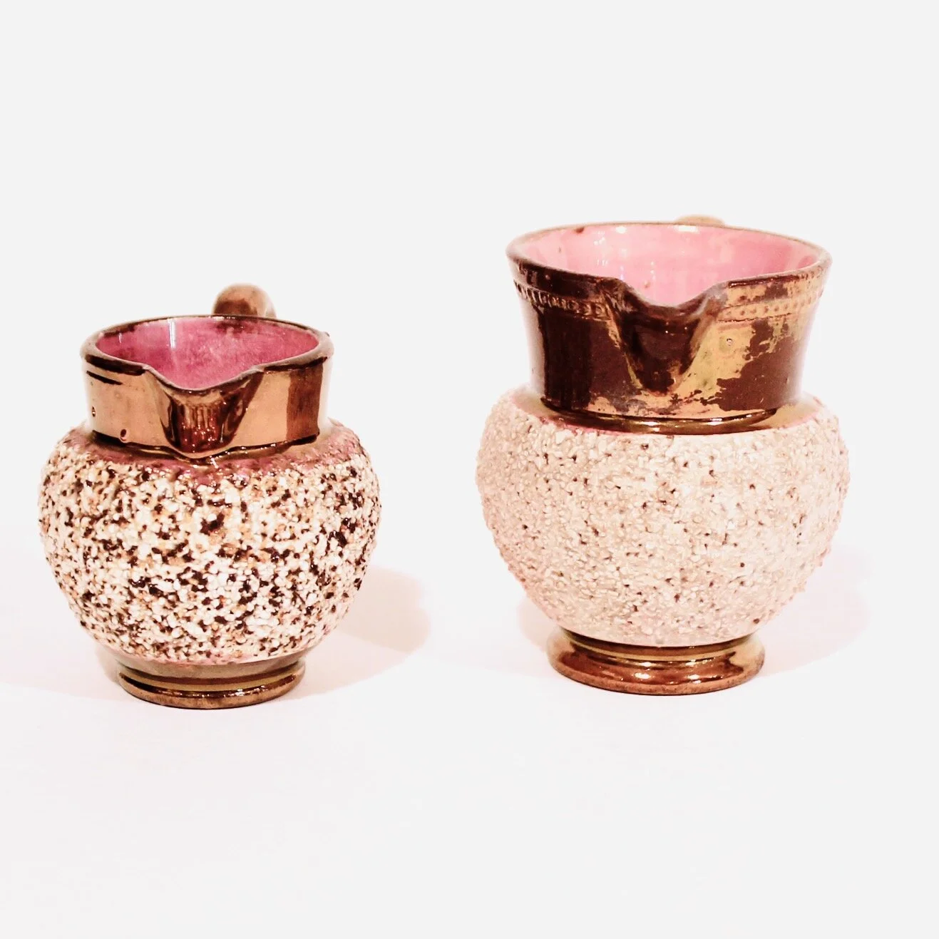 Pair of Miniature Copper Lustre Ware Cream Pitchers with Low Relief Textured Bodies