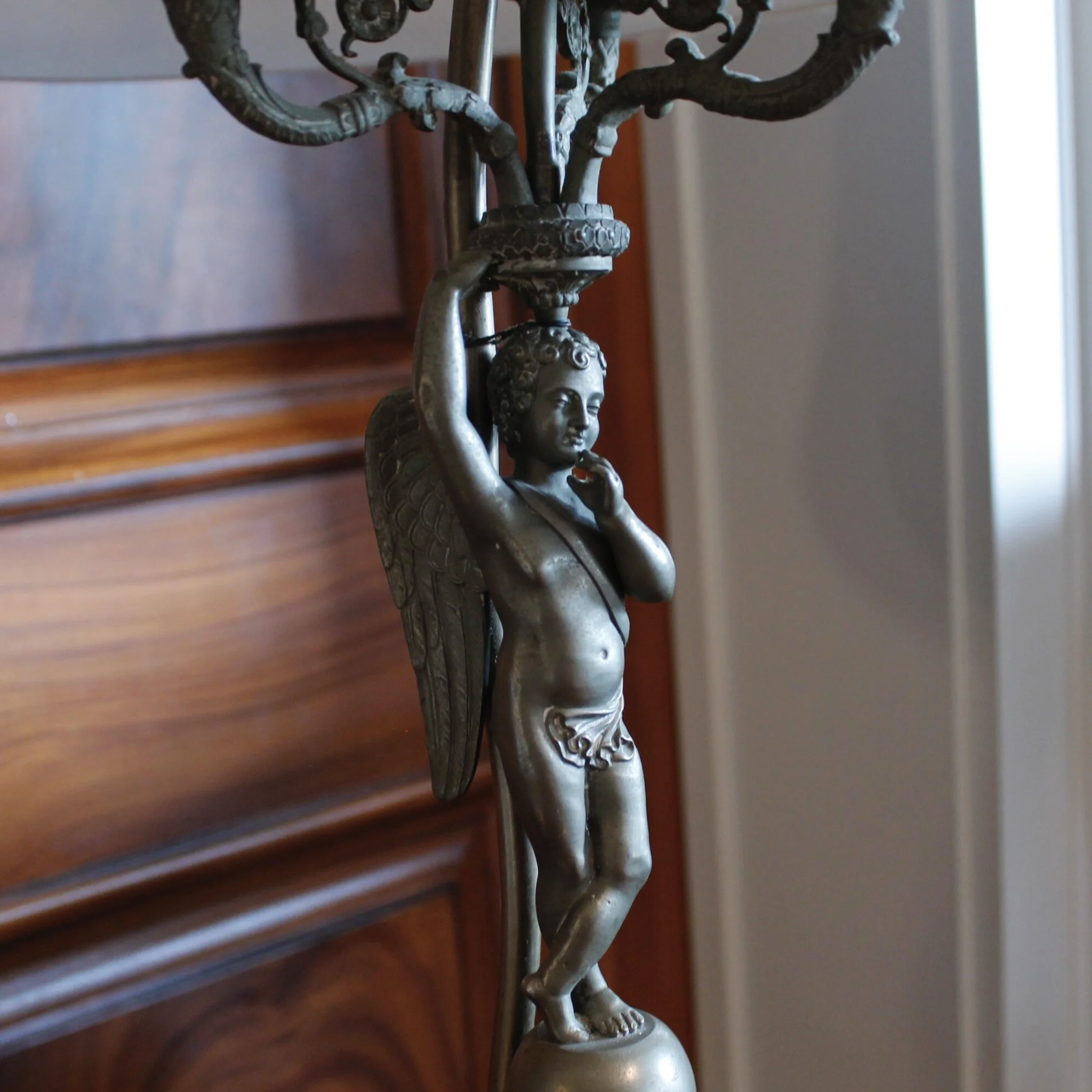 Pair of Continental Pewter Winged Putto Figural Candelabra Lamps