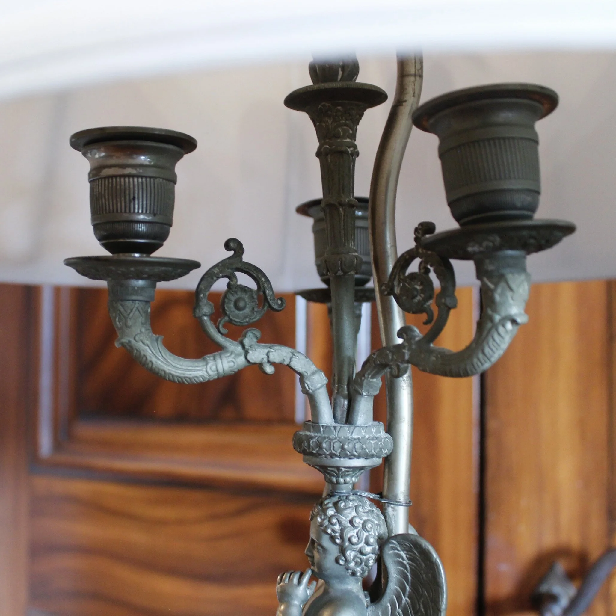 Pair of Continental Pewter Winged Putto Figural Candelabra Lamps