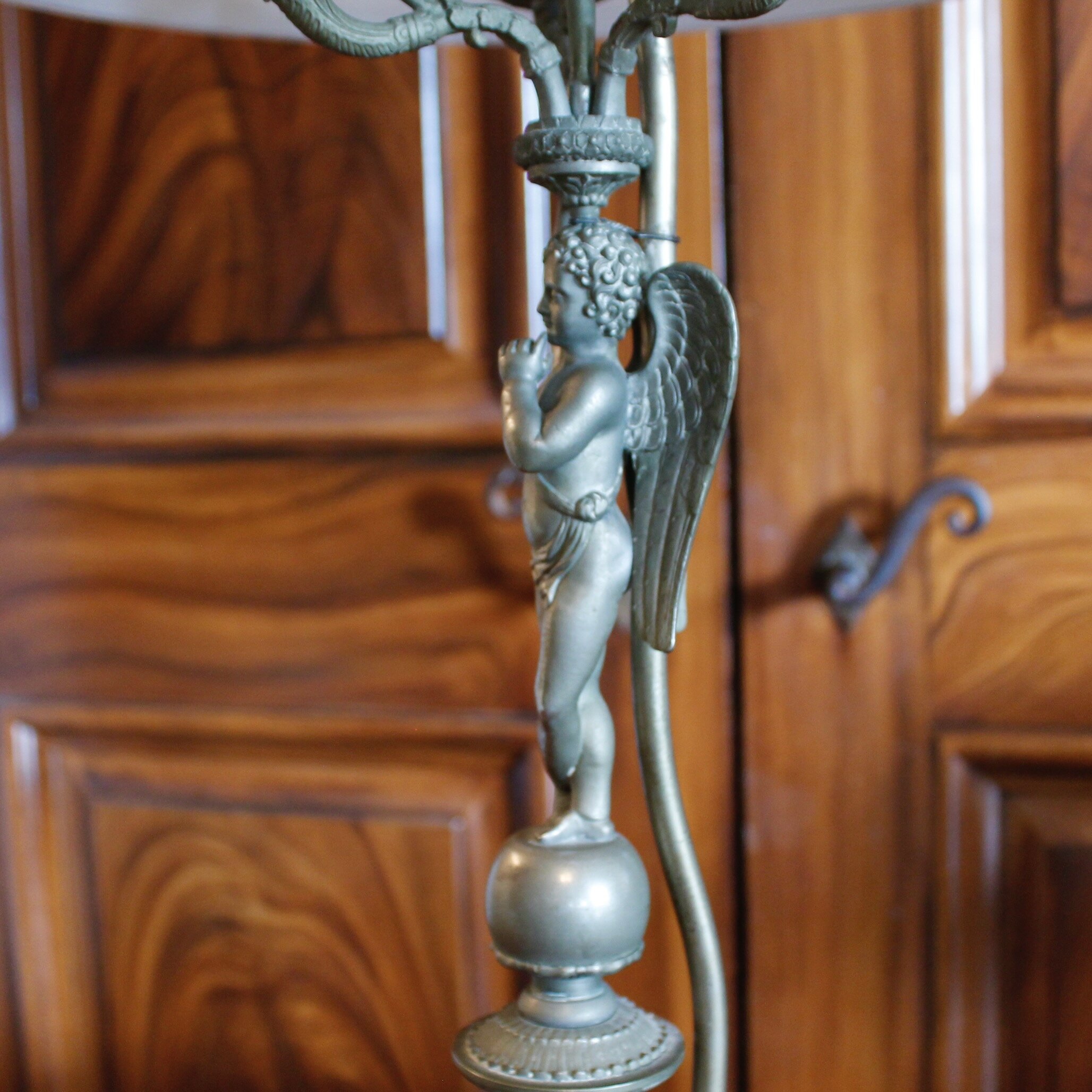 Pair of Continental Pewter Winged Putto Figural Candelabra Lamps