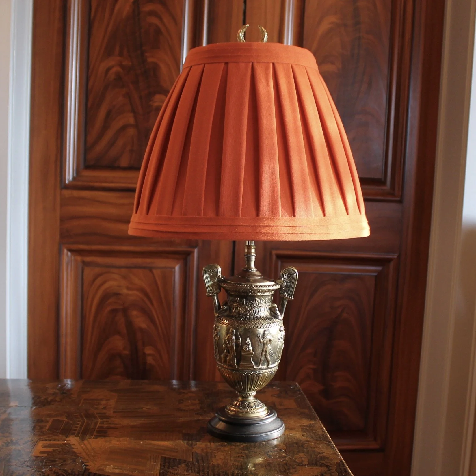 Pair of Polished Bronze Neoclassical Urn Lamps with Orange Linen Shades