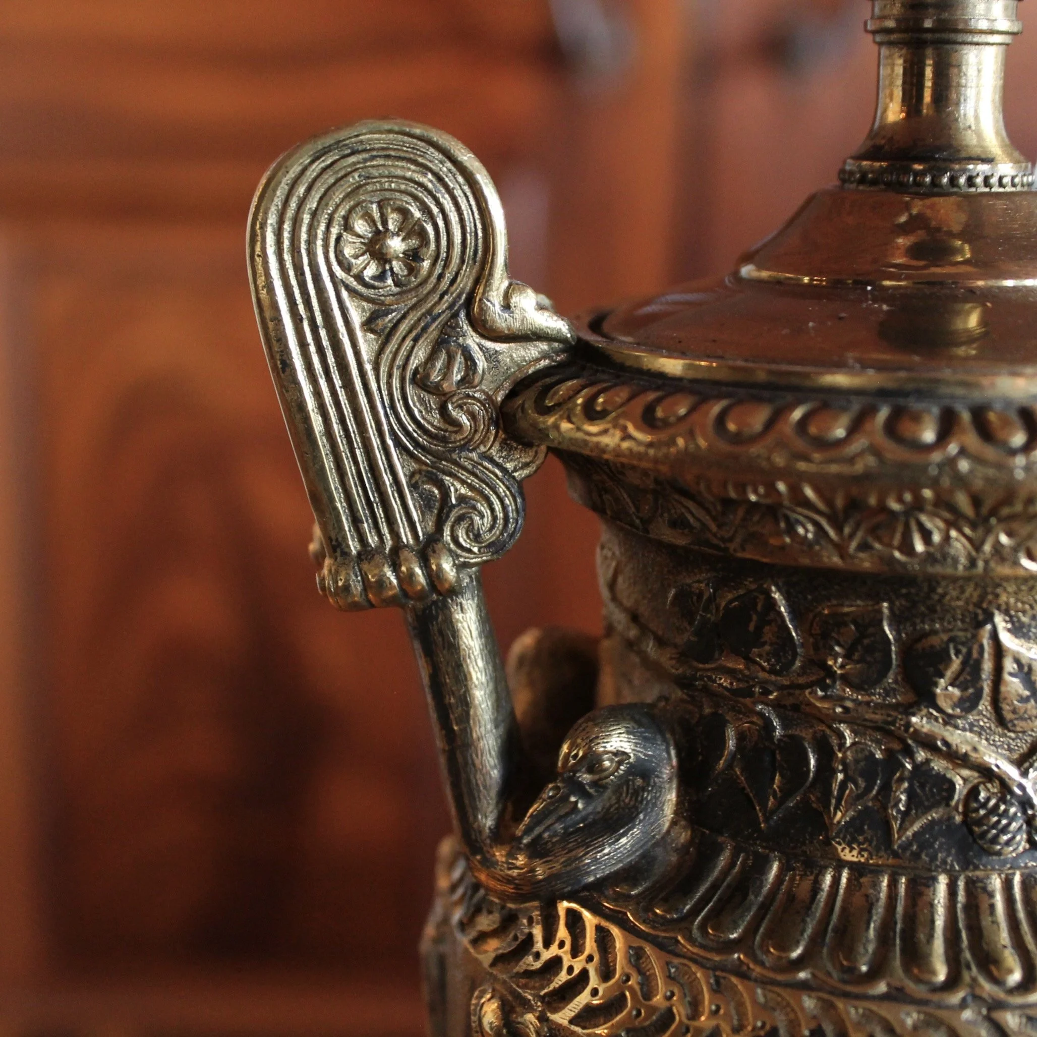 Pair of Polished Bronze Neoclassical Urn Lamps with Orange Linen Shades