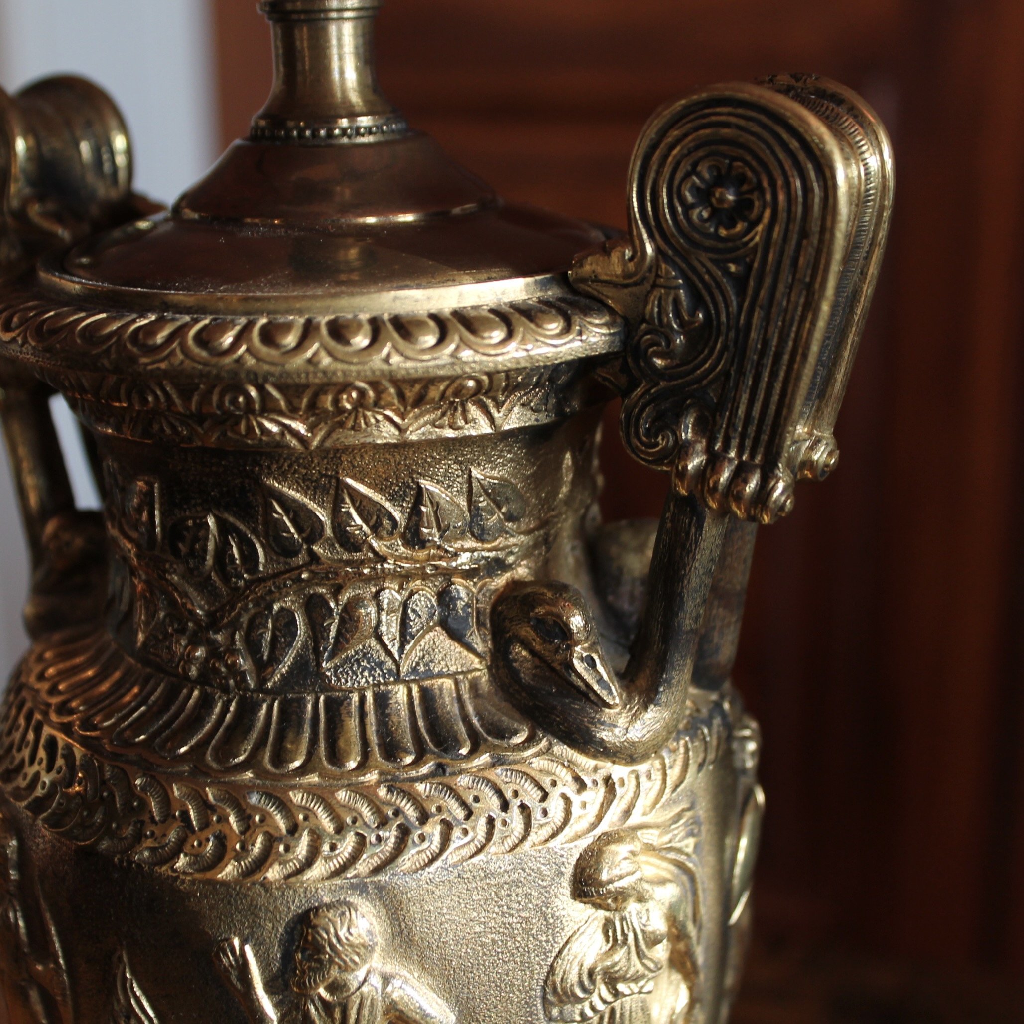 Pair of Polished Bronze Neoclassical Urn Lamps with Orange Linen Shades