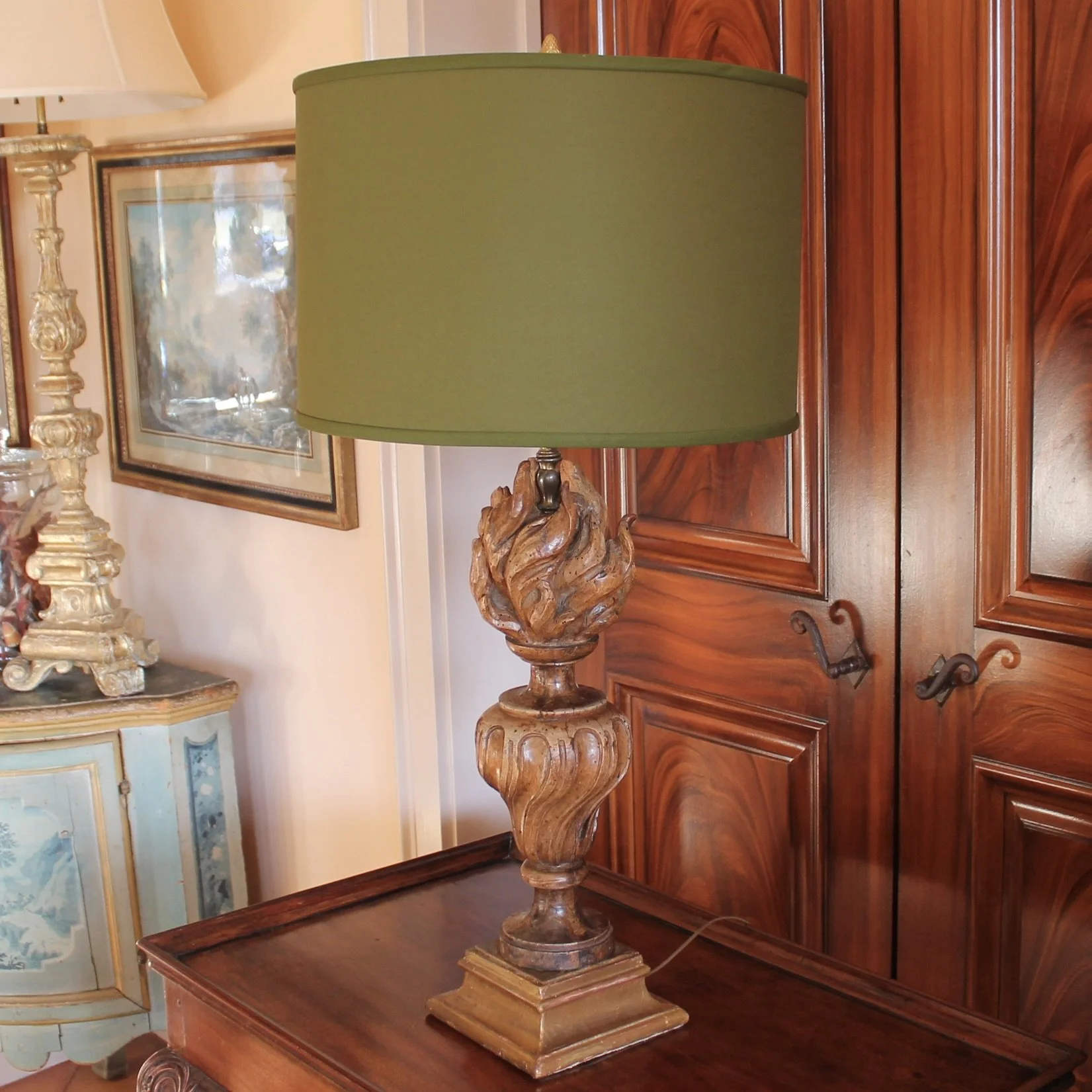 Antique carved flame lamp