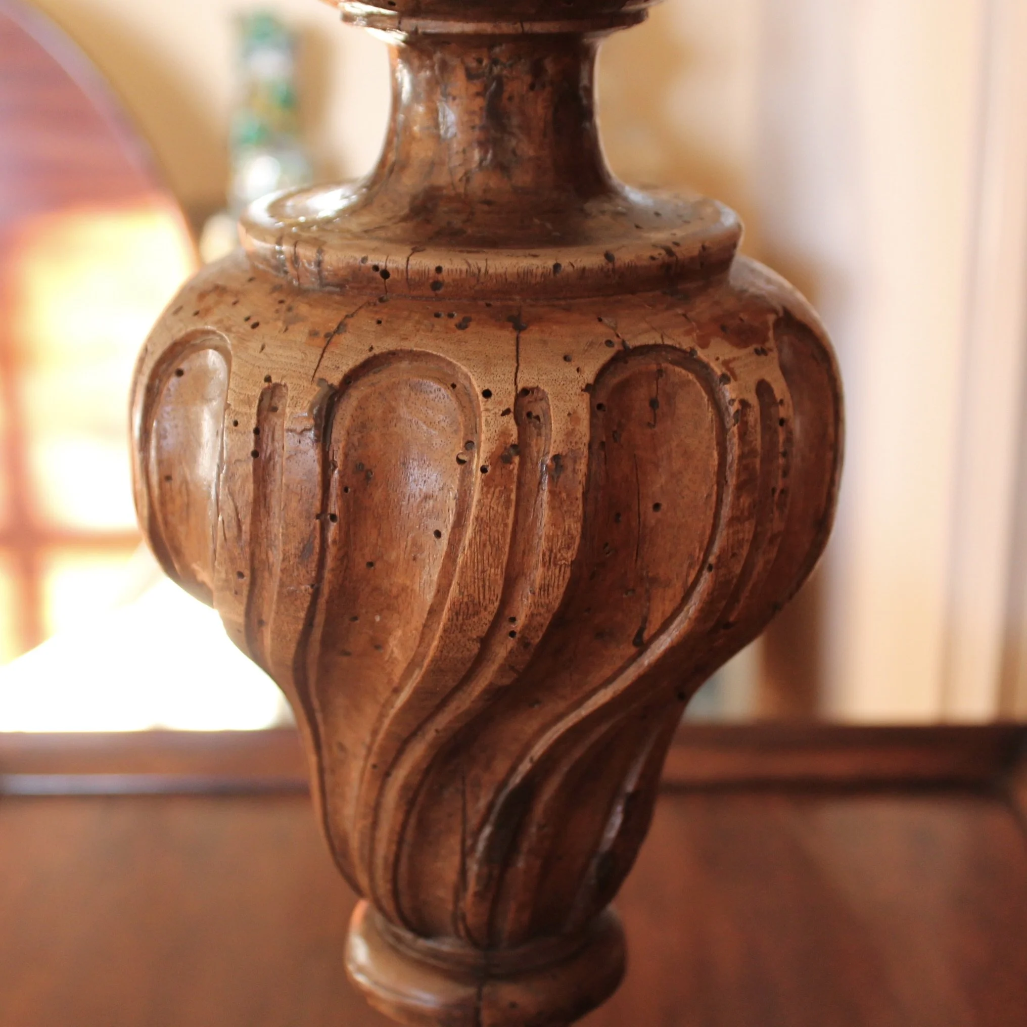 Antique carved flame lamp