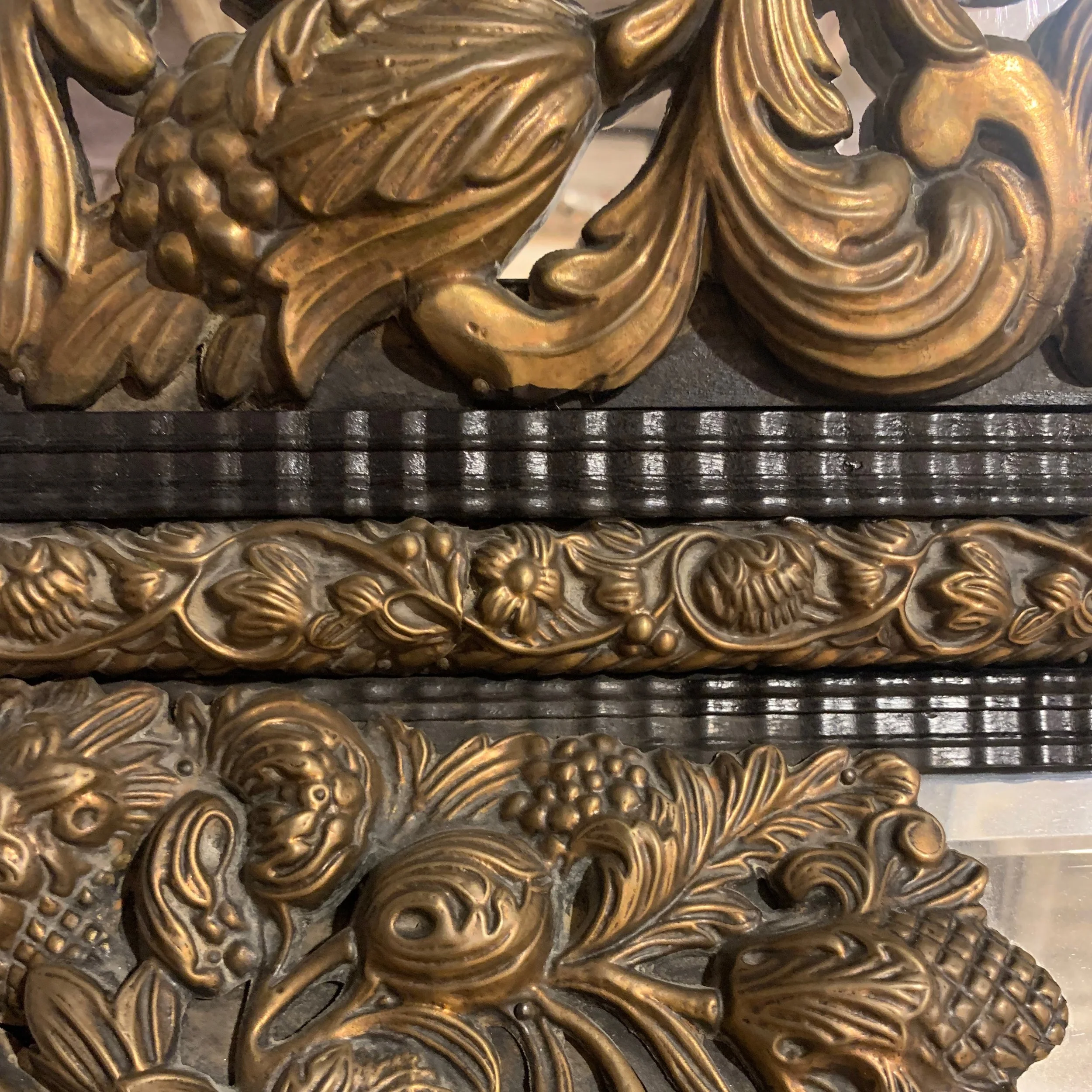Large-Continental-Brass Repoussé-and-Ebonized-Crested-Cushion-Mirror (3)-detail