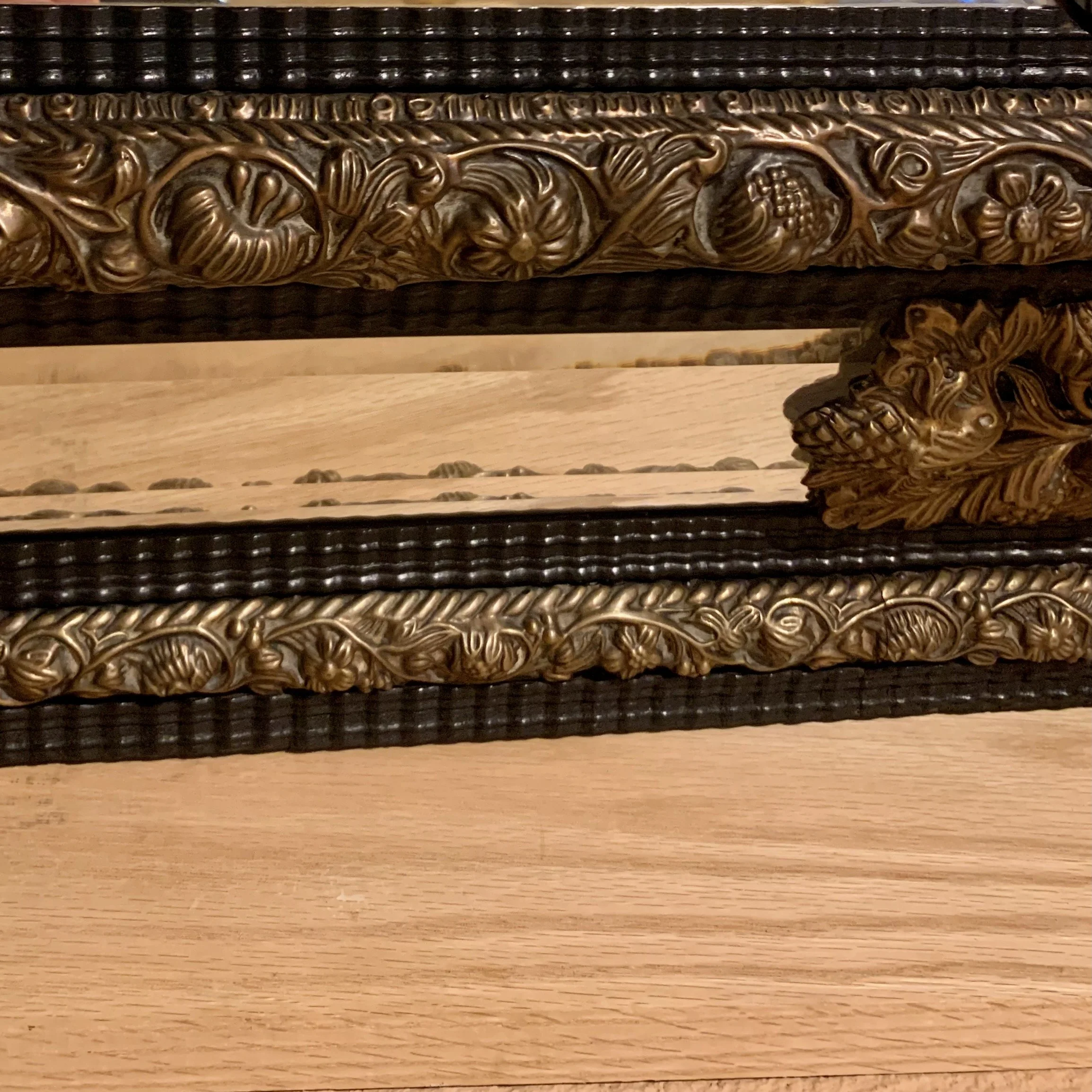 Large-Continental-Brass Repoussé-and-Ebonized-Crested-Cushion-Mirror (6)-detail