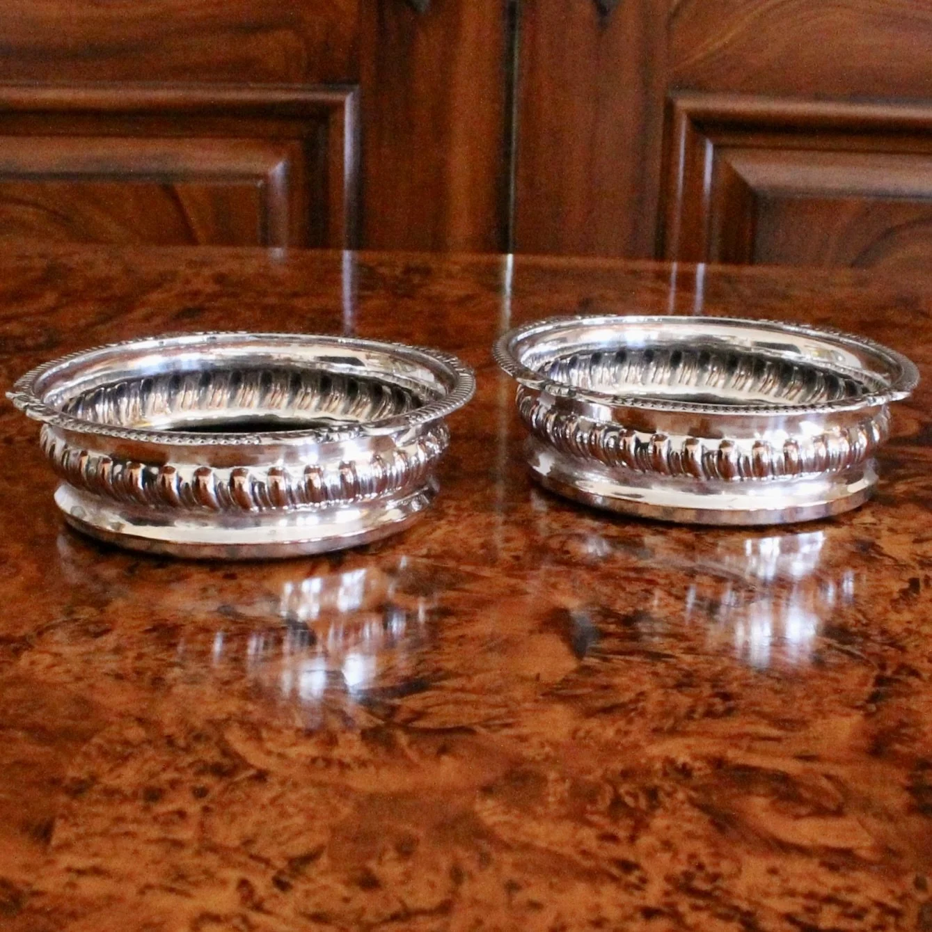 English Silver on Copper Gadrooned Wine Bottle Coasters, pair