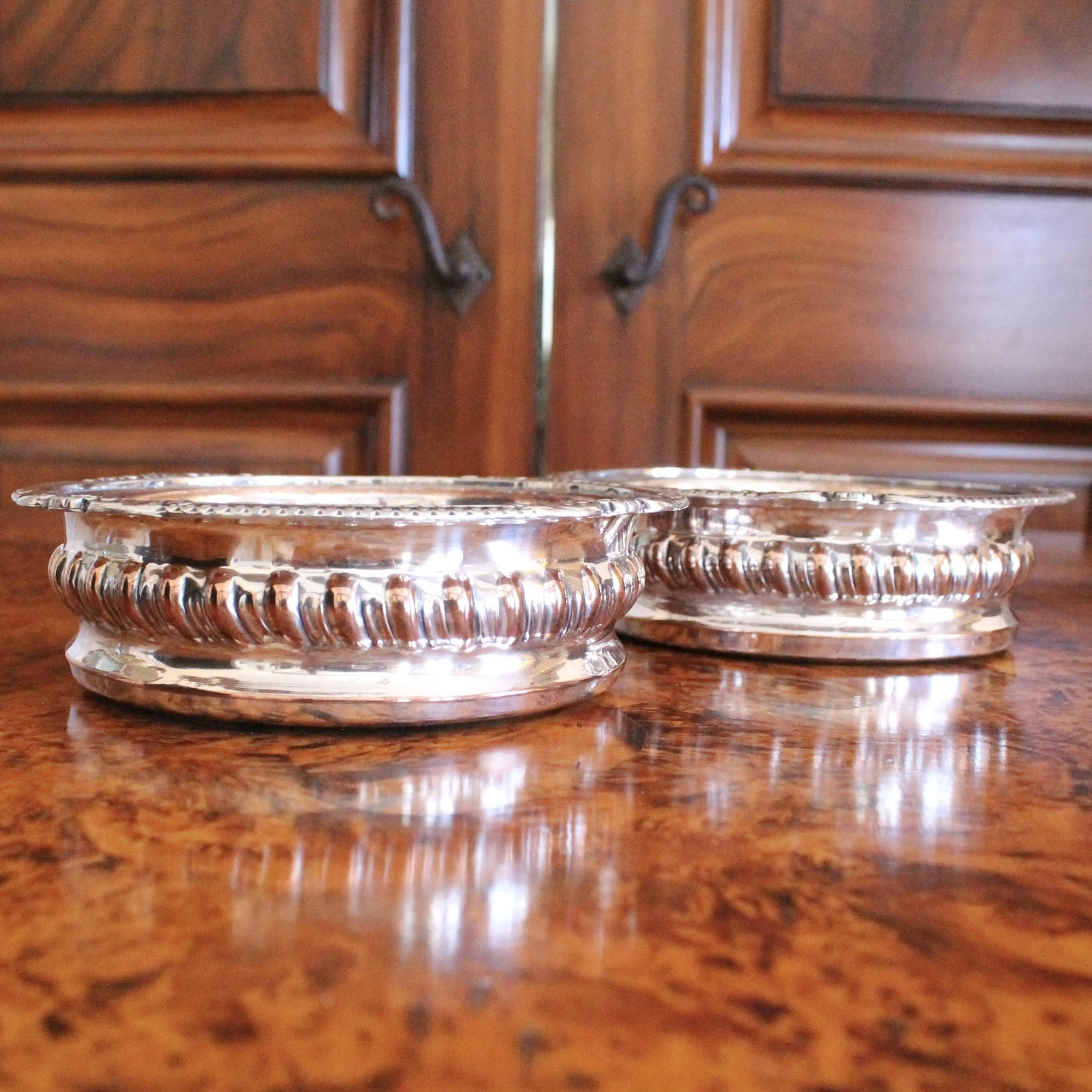 English Silver on Copper Gadrooned Wine Bottle Coasters, pair