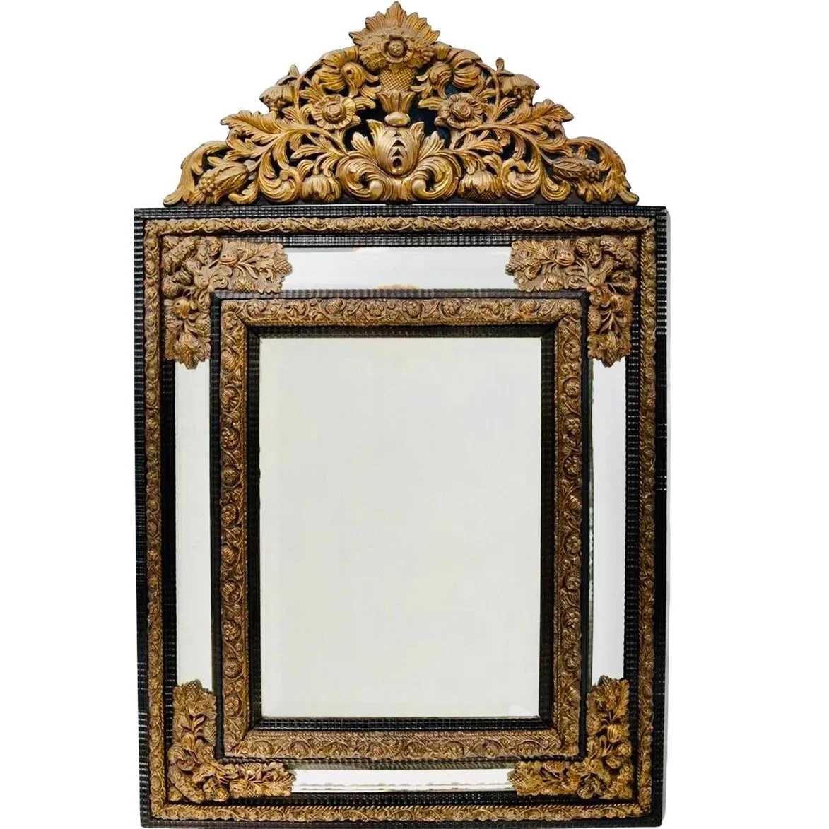 Large Continental Brass Repoussé and Ebonized Crested Cushion Mirror
