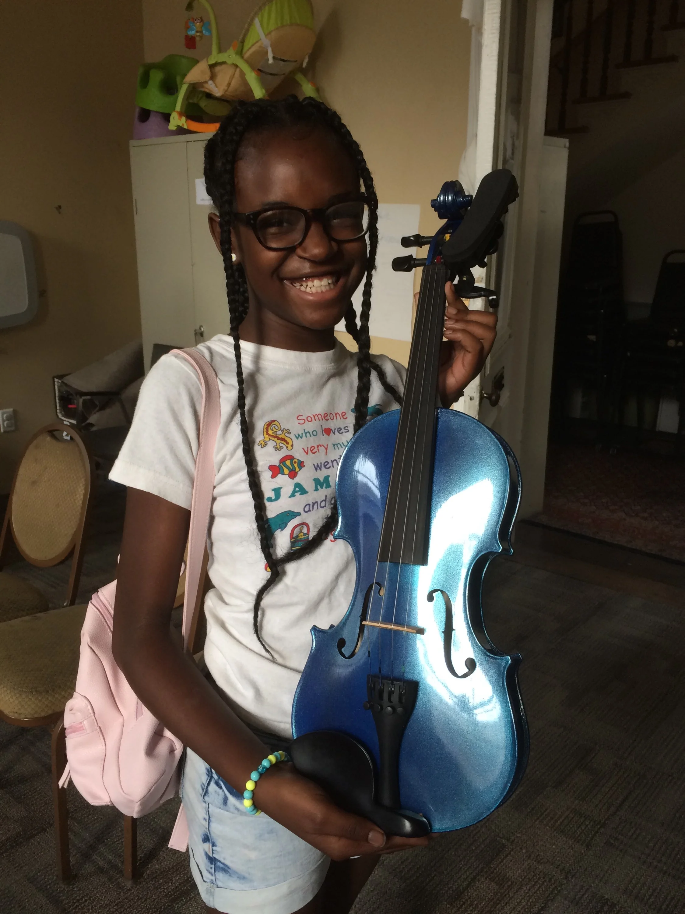Tierra with violin donation.jpg