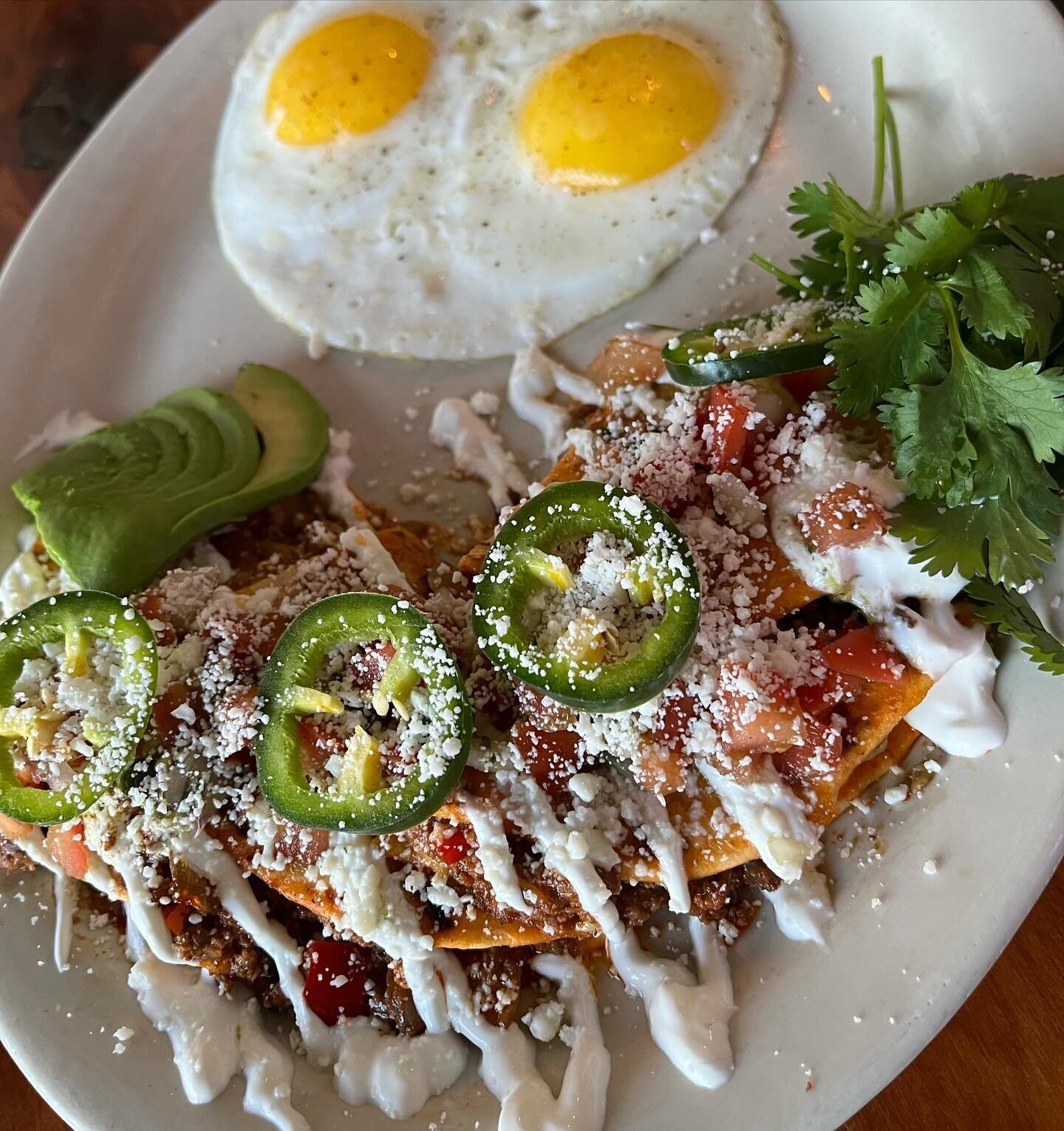 Come on in for the Breefadilla breakfast special! Flour tortillas filled with Jack Mountain Meat&rsquo;s ground beef, smoked gouda &amp; jack cheeses, red chili &amp; guajillo sauce, garlic and saut&eacute;ed peppers &amp; onions. Topped with sour cr