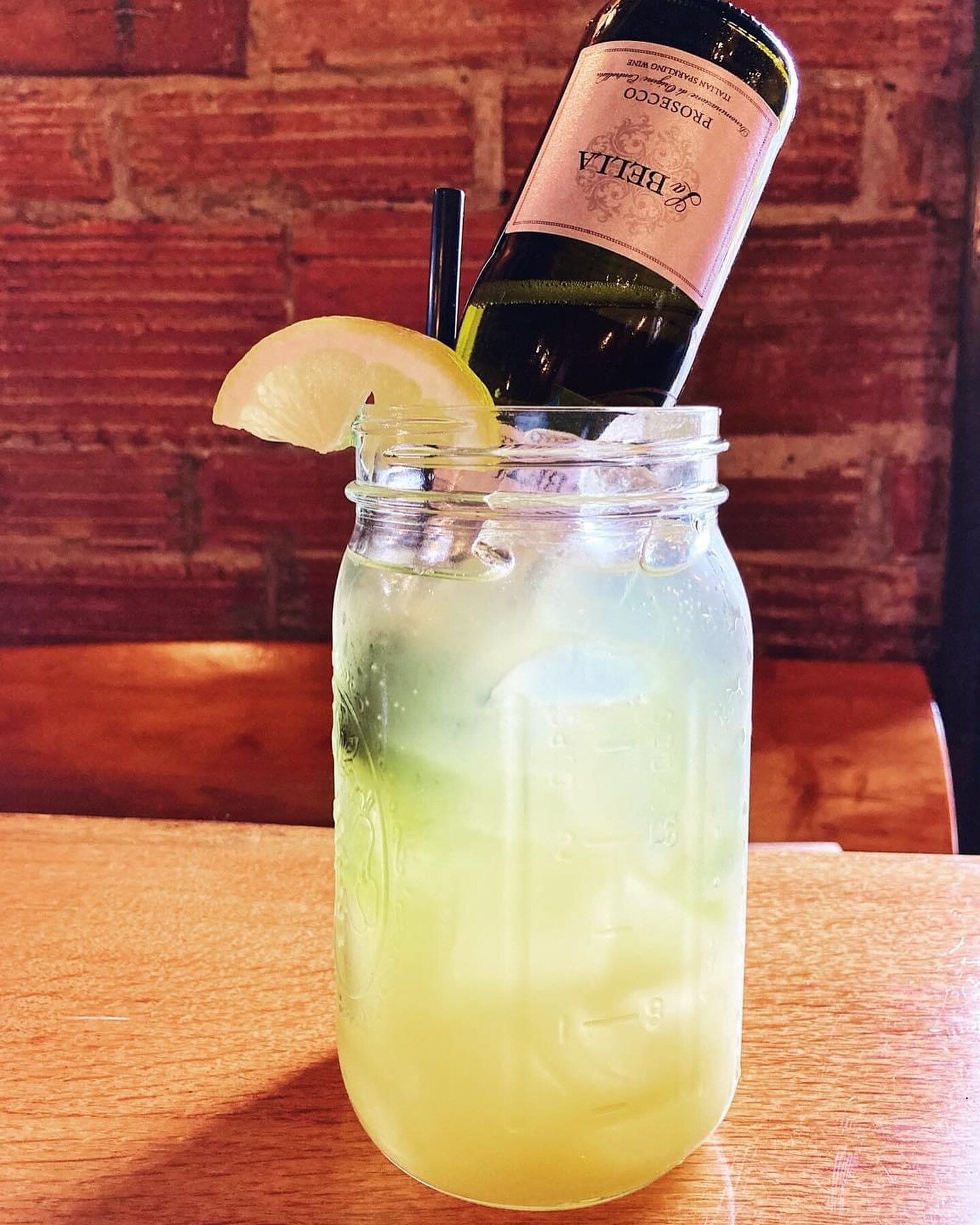 Last call for our Pot o&rsquo; Gold Freshie! Absolut Citron, caramelized pineapple purée, lemonade, and soda, topped with a Prosecco split and a float of Bols Melon, garnished with a lemon. 🍋