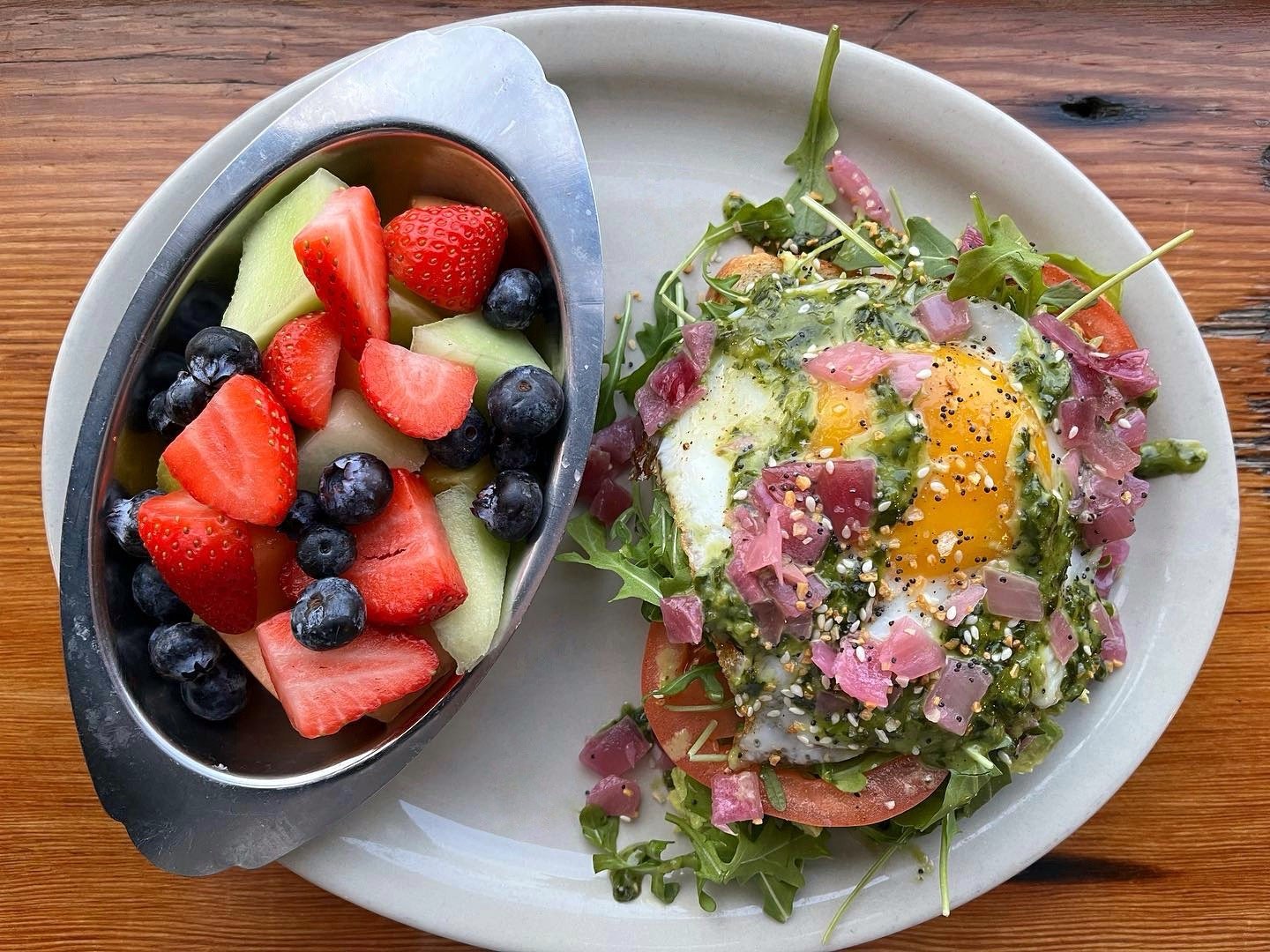 Avocado Toast is on special for breakfast! 🥑 Toasted wheat bread topped with avocado, arugula, tomato, fried egg, basil vinaigrette, pickled red onion &amp; everything bagel seasoning, served with fresh fruit.