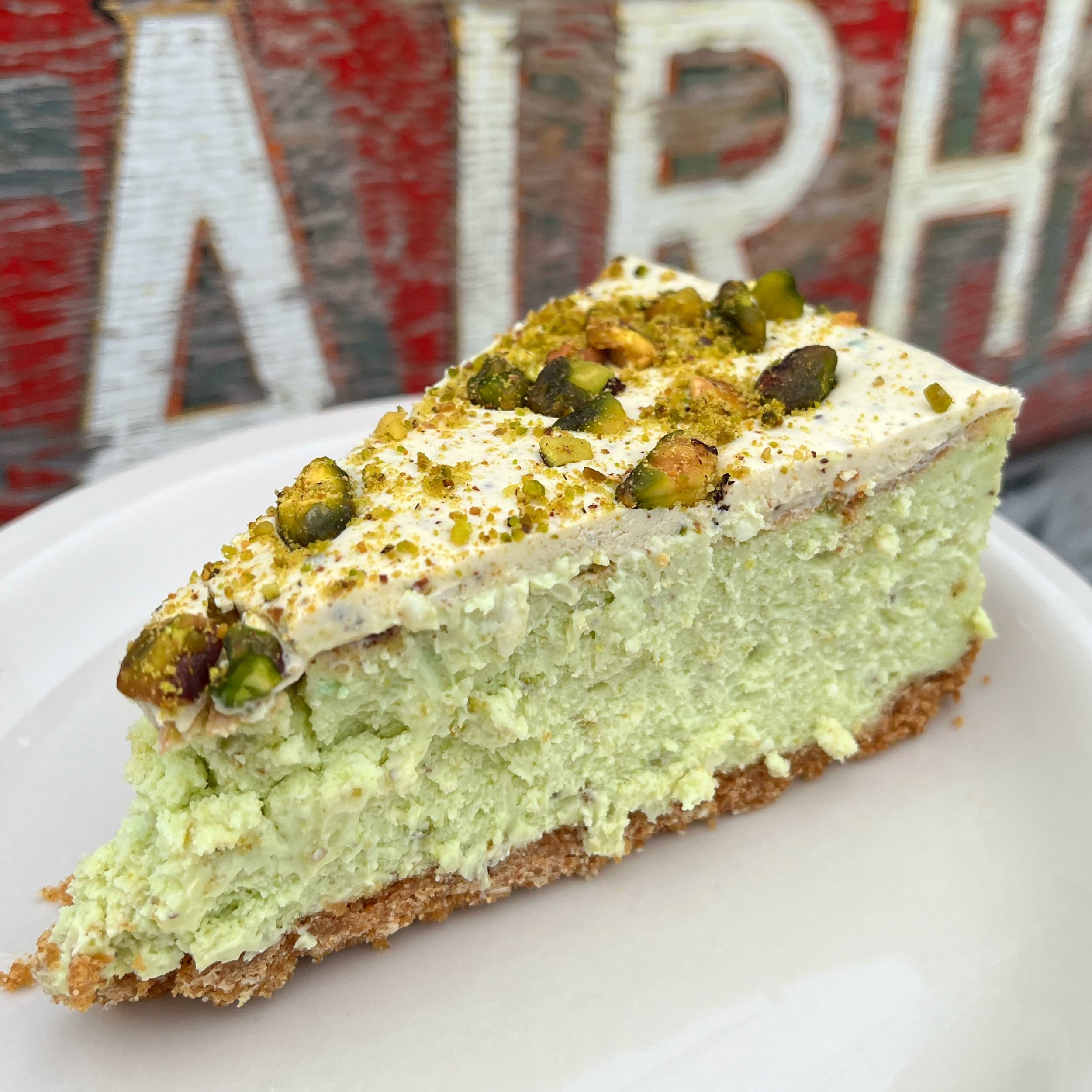Save room for a slice of Pistachio White Chocolate Cheesecake. Baked in house and on special for the week here at Train Wreck!