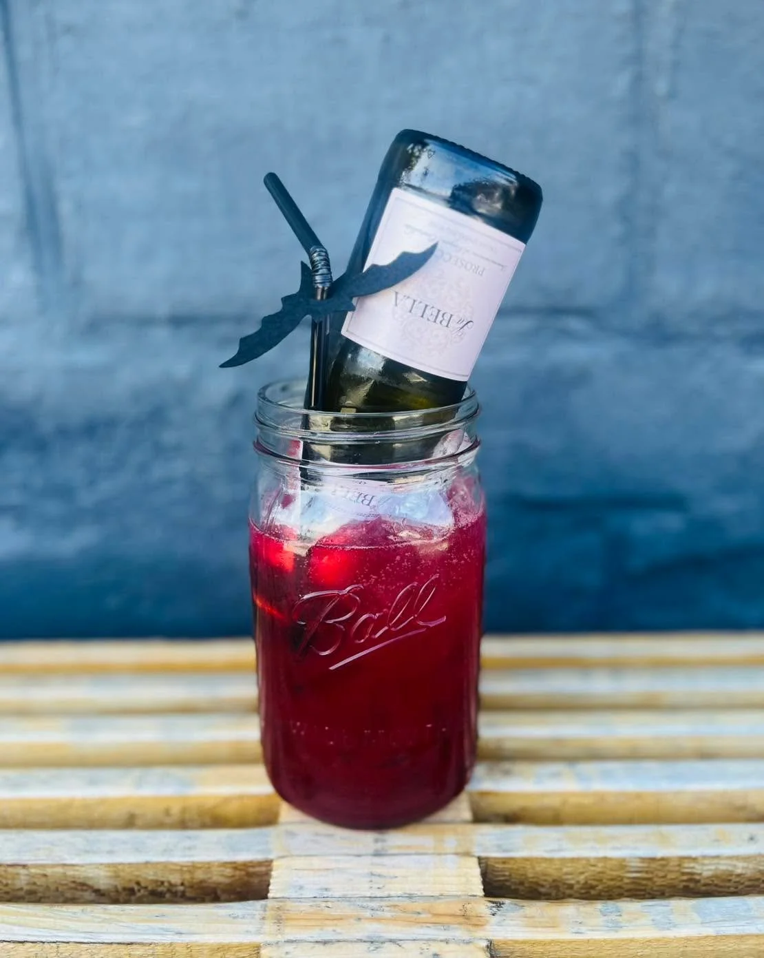 🦇 The Raspberry Reaper Freshie is made with raspberry vodka, black currant purée, and a splash of sour. Topped with a Prosecco split and a spooky bat straw.
