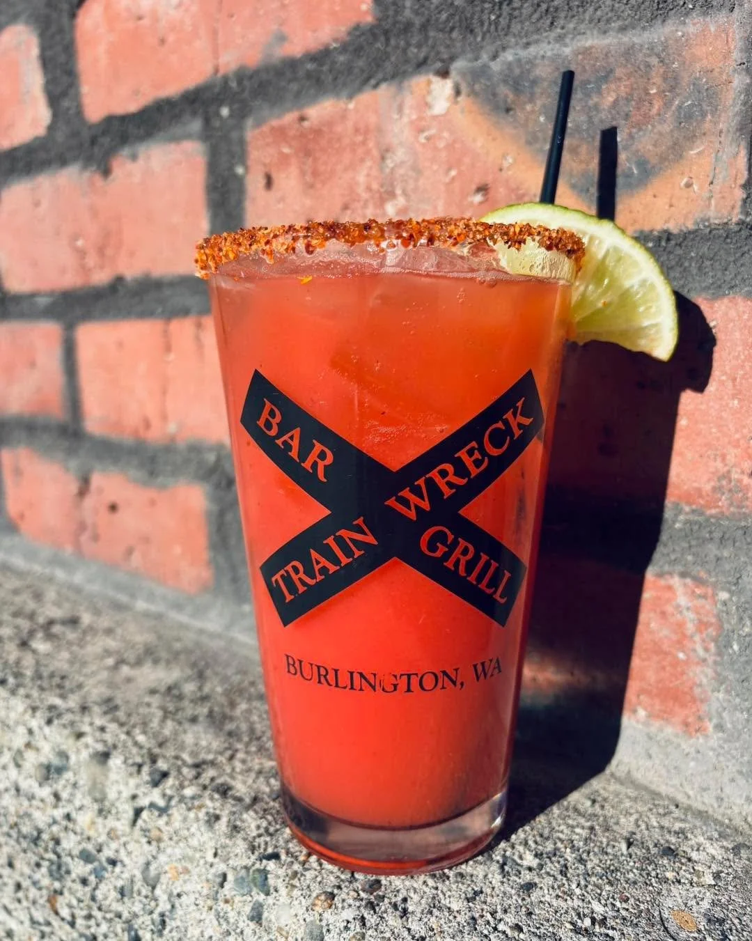 Strawberry Paloma, $11 all day for Train Wreck&rsquo;s #MargMonday 🍓 Puerto Vallarta Tequila, fresh strawberry puree, lime juice, and grapefruit juice shaken, topped with 7Up, and served with a Tajin rim and a lime. 🍋&zwj;🟩