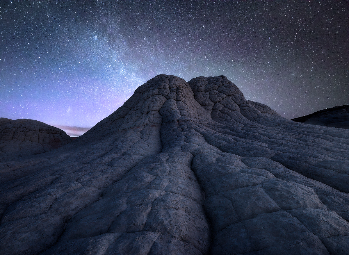 "Stones of Silence" -- brain rocks glow under a star filled sky Nikon D800e, Nikon 14-24mm @ 18mm, f/ 11 for the land. Second exposure at f/2.8 for 20 seconds for sky. Exposures taken several hours apart but from same position 