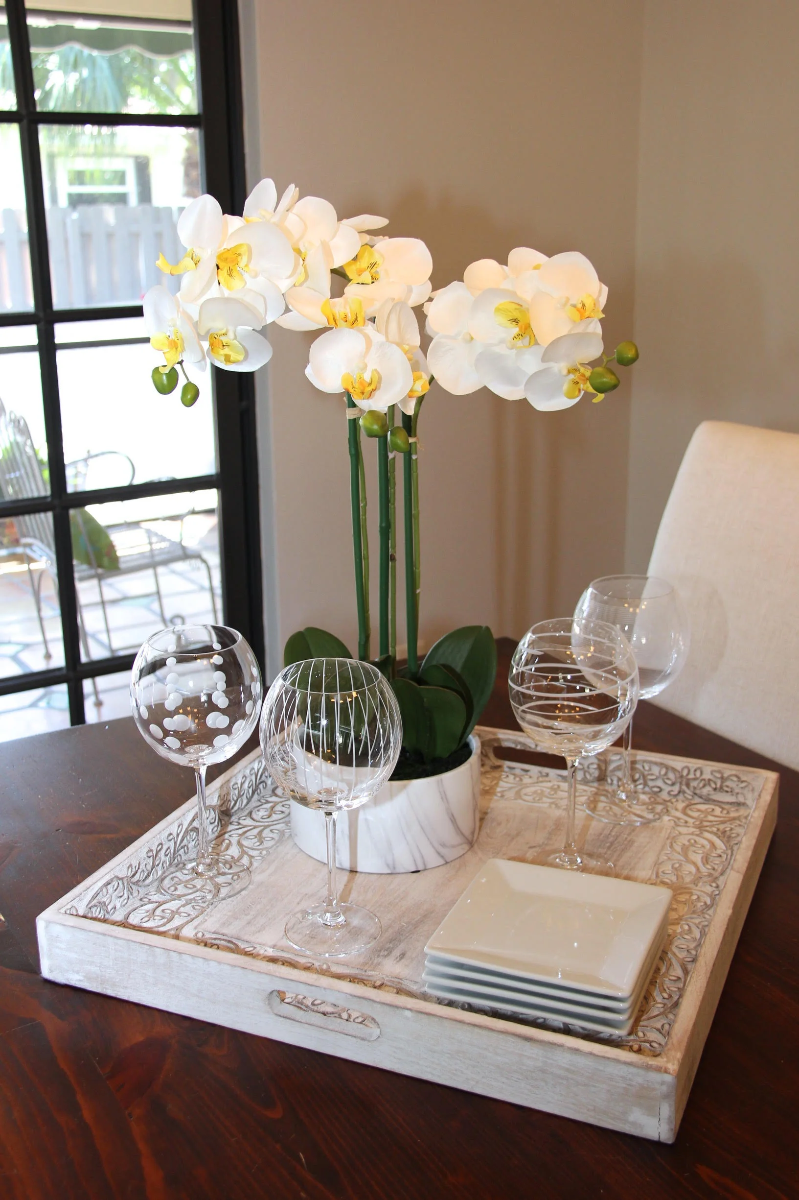 Staged dining room with orchids