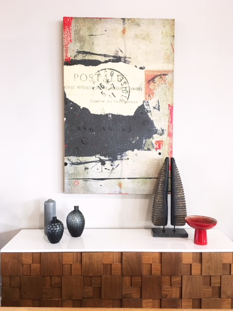 home staging in delray beach of a Modern beach living room sideboard with vases, sculpture, and modern artwork