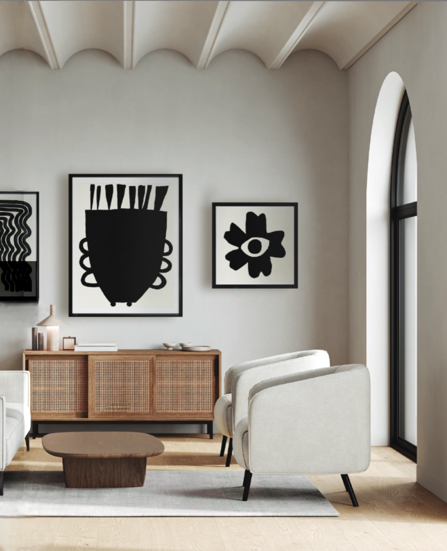 This neutral living room in Delray Beach shows an unusual curved ceiling detail, neutral furnishings, paired with white and black graphic art.