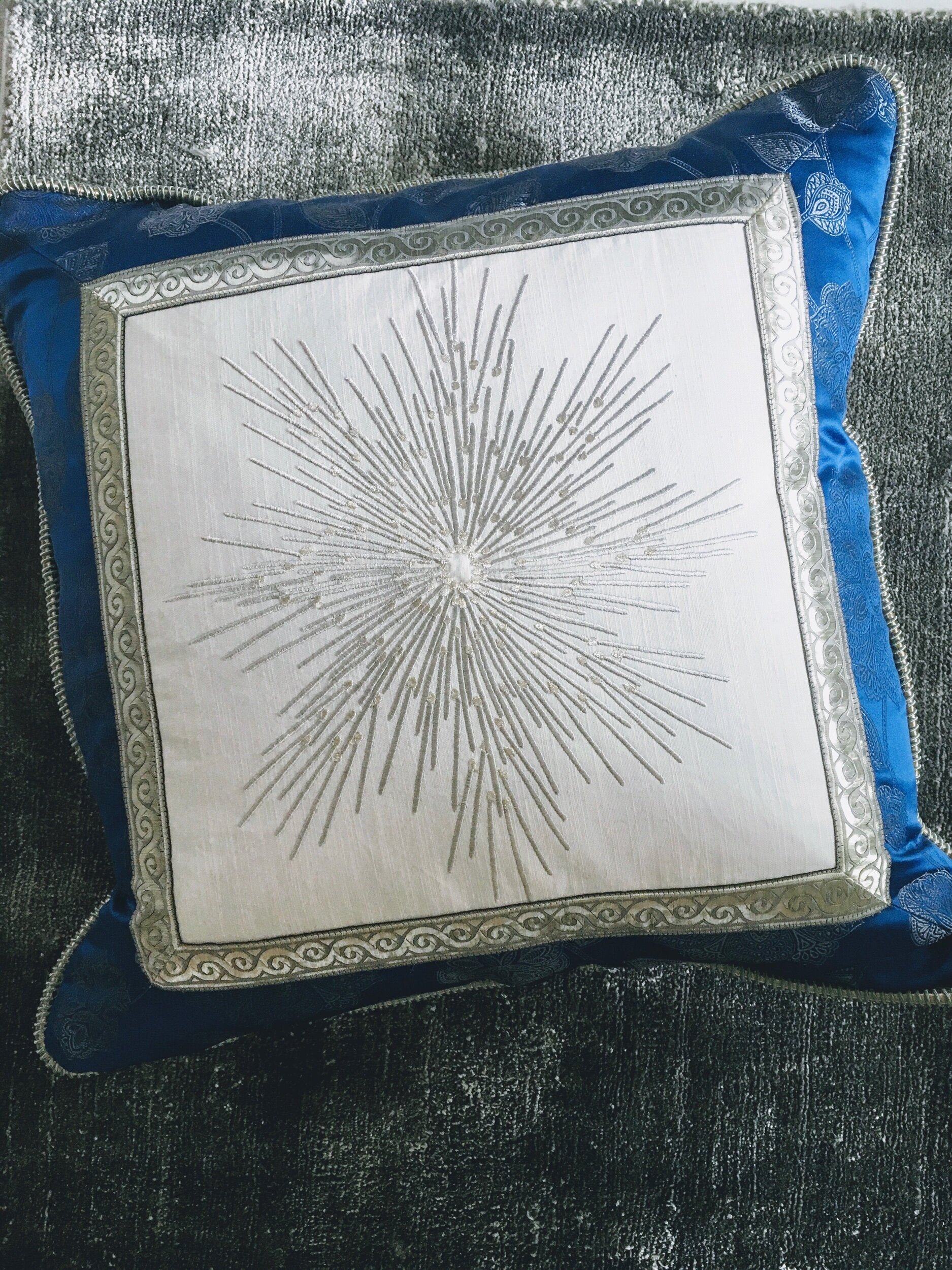home Styling in delray beach with custom pillow on grey sofa