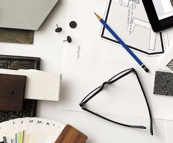 The designer desktop shows various building selections being sourced for a project.