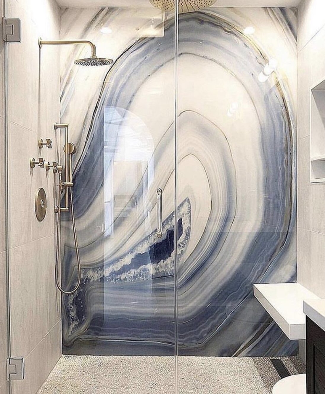 Bathroom shower with blue agate wall and mosaic 