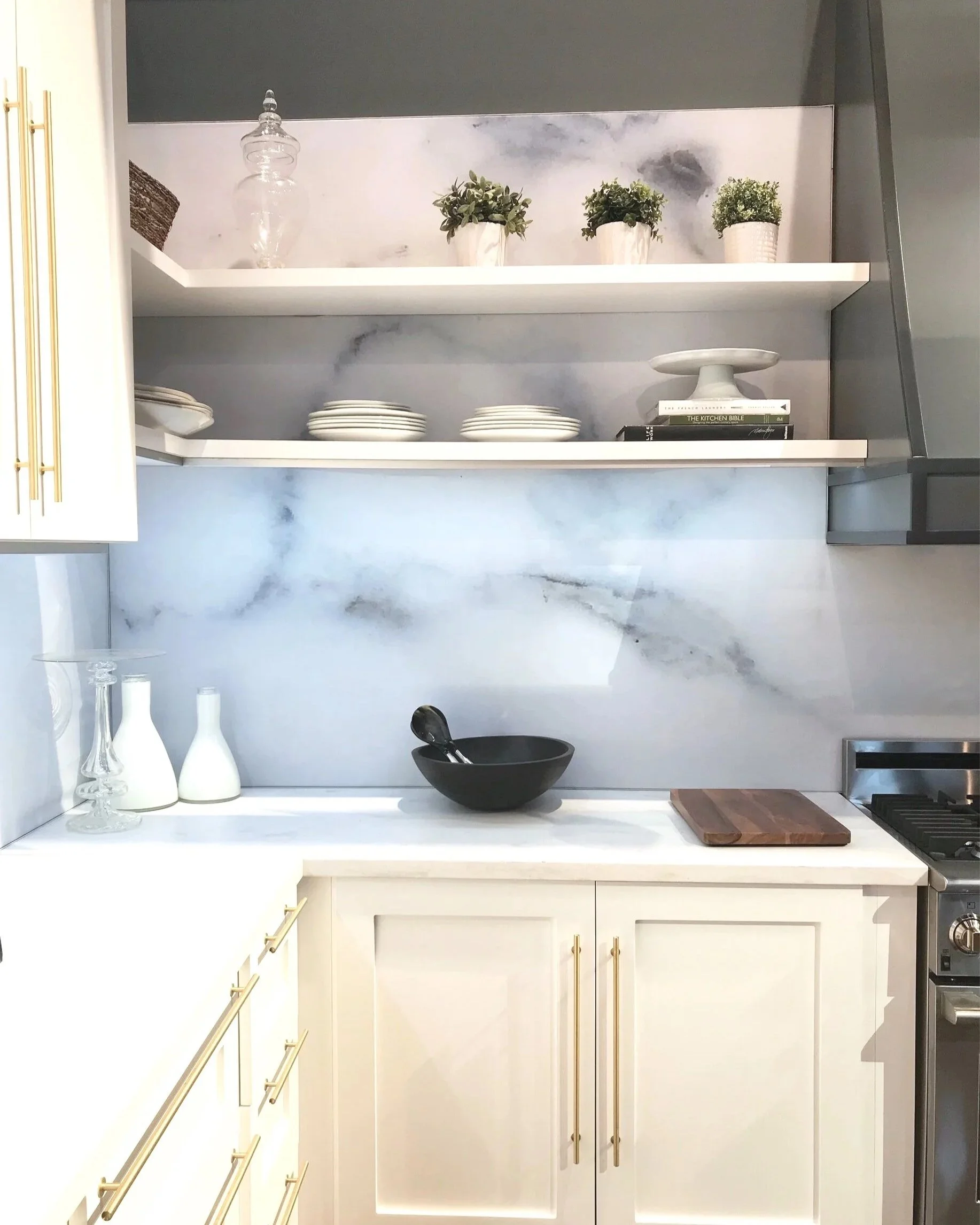 Kitchen  off white cabinetry with marble backsplash and open shelves 